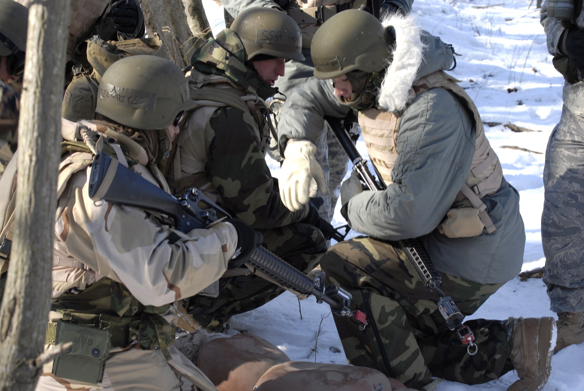 Students in the Advanced Contingency Skills Training Course 09-3 participate in a scenario for combat first aid on Feb. 5, 2009, on a Fort Dix, N.J., range.  The course, taught by the U.S. Air Force Expeditionary Center's 421st Combat Training Squadron, prepares Airmen for upcoming deployment providing combat skills training in everything from combat first aid and convoy operations to patrolling and tactics.  (U.S. Air Force Photo/Staff Sgt. Paul R. Evans)
