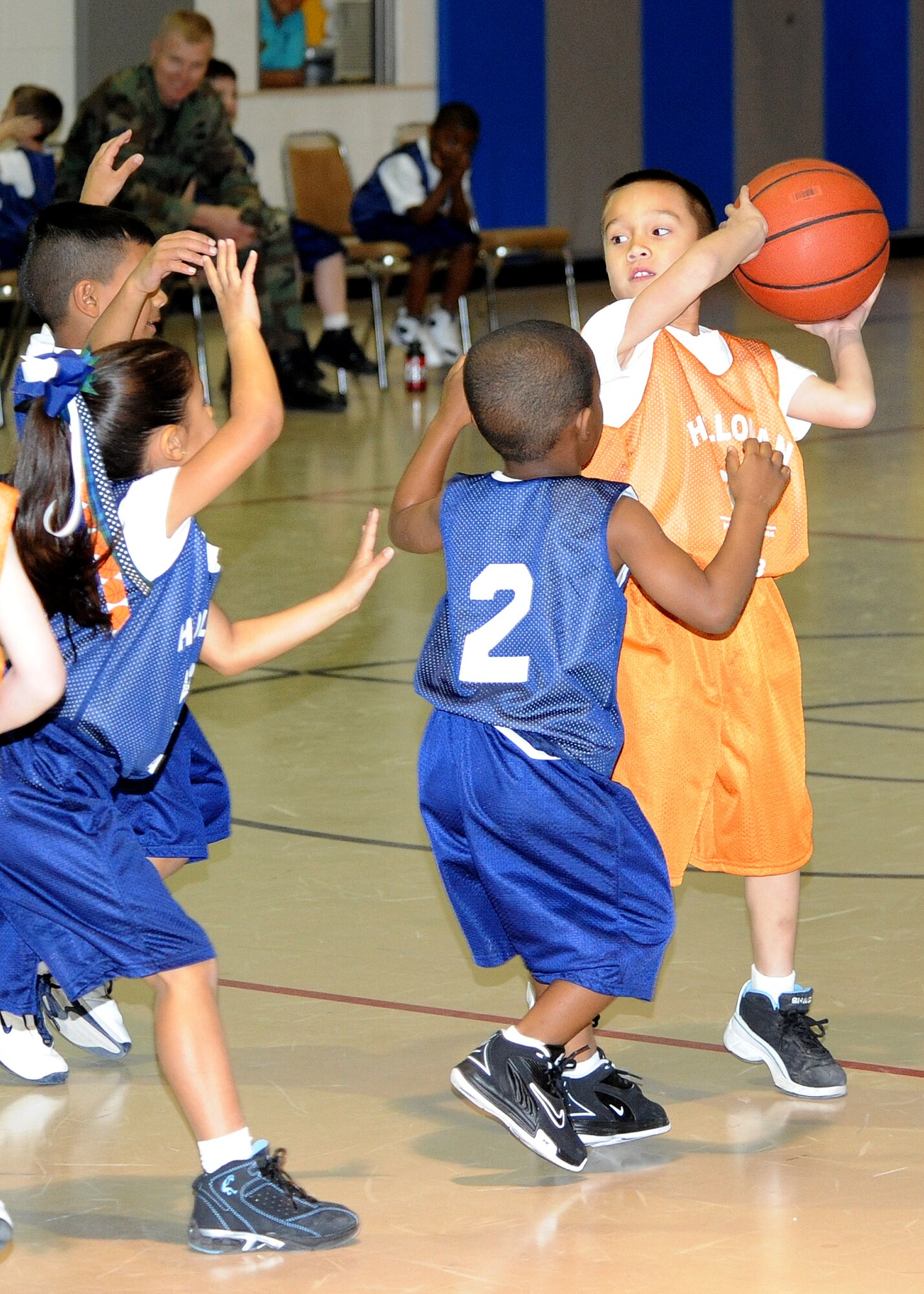 Children from the Youth and Teens Center play in a basketball game at Holloman Air Force Base, N.M., Feb. 12.  The Holloman Youth and Teen Center host several seasonal sports programs for youths such as soccer, tee ball, baseball and basketball. (U.S. Air Force photo/Senior Airman Michael Means)

