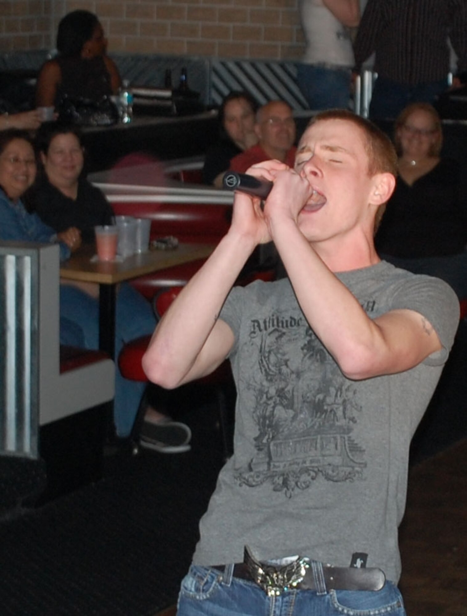 Airman 1st Class Travis Snyder from the 601st AOC belts out "Born to Be Wild" to the crowd at Tyndall Idol.  The first show was on Friday, and will happen each Friday at the Zone in Horizons until March 6.  Contestants are competing for a 5-day cruise for two to Cozumel.  Video and bios are available for the contestants on www.tyndallidol.com.  (Photo by Jeff Coleman)