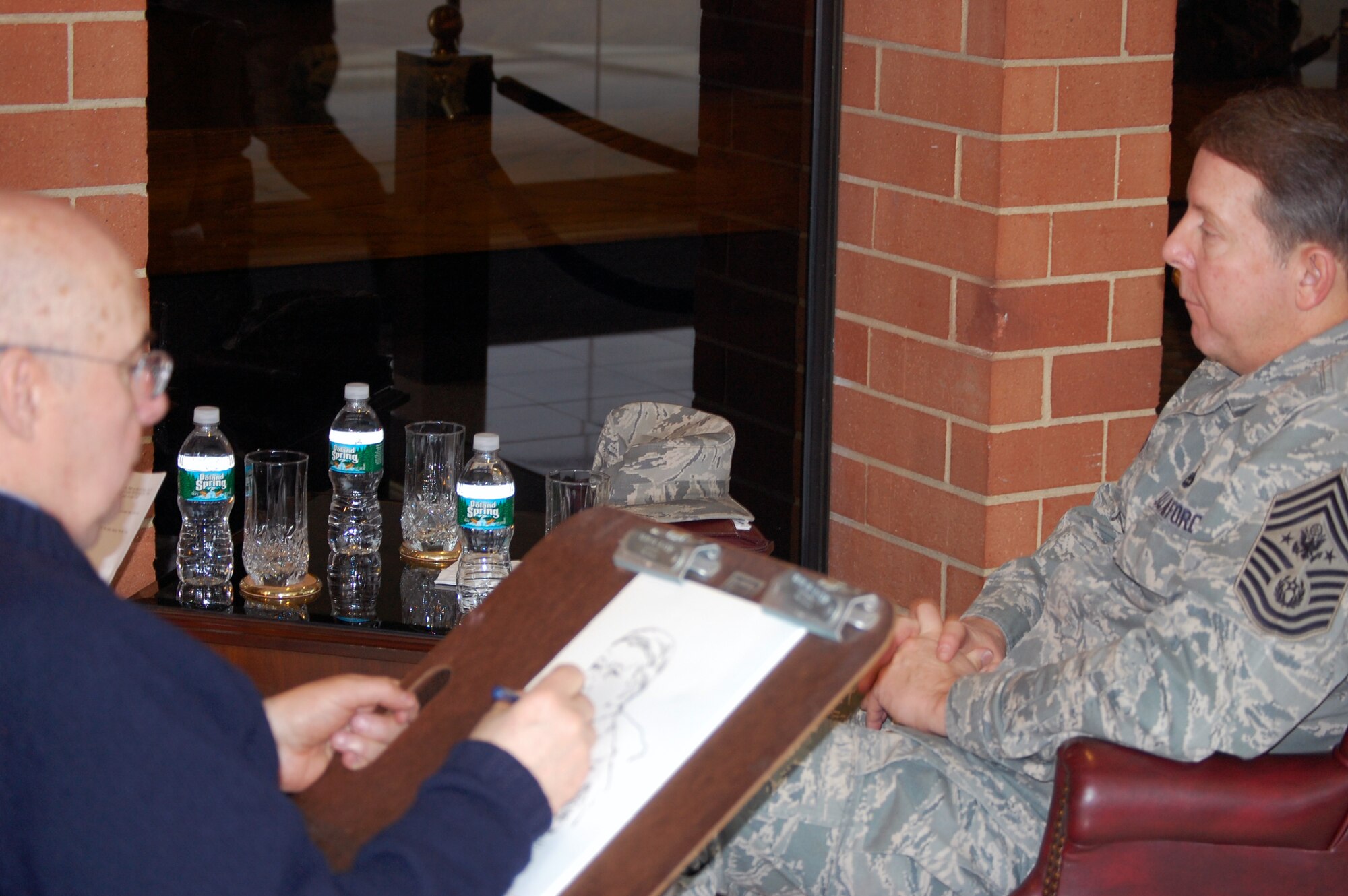 Mr. John Witt, artist and chairman of the New York Society of Illustrators, draws a sketch of Chief Master Sgt. of the Air Force Rodney J. McKinley on Feb. 10, 2009, in the U.S. Air Force Expeditionary Center on Fort Dix, N.J.  Mr. Witt created the sketch to give to the Chief during his familiarization visit of the center.  The sketch eventually becomes part of the collection in the Air Force Art Program.  (U.S. Air Force Photo/Tech. Sgt. Scott T. Sturkol)