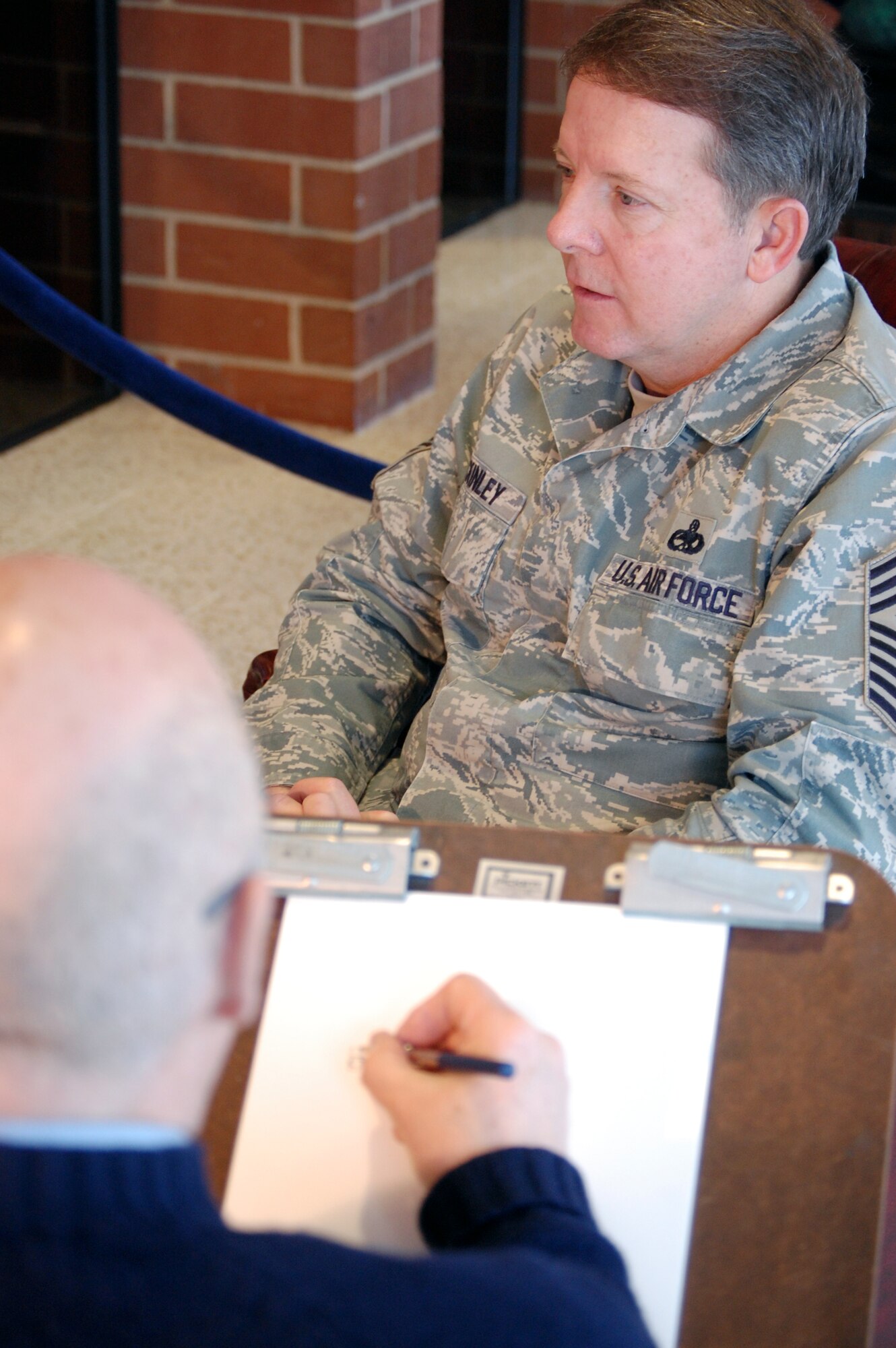 Mr. John Witt, artist and chairman of the New York Society of Illustrators, draws a sketch of Chief Master Sgt. of the Air Force Rodney J. McKinley on Feb. 10, 2009, in the U.S. Air Force Expeditionary Center on Fort Dix, N.J.  Mr. Witt created the sketch to give to the Chief during his familiarization visit of the center.  The sketch eventually becomes part of the collection in the Air Force Art Program.  (U.S. Air Force Photo/Tech. Sgt. Scott T. Sturkol)