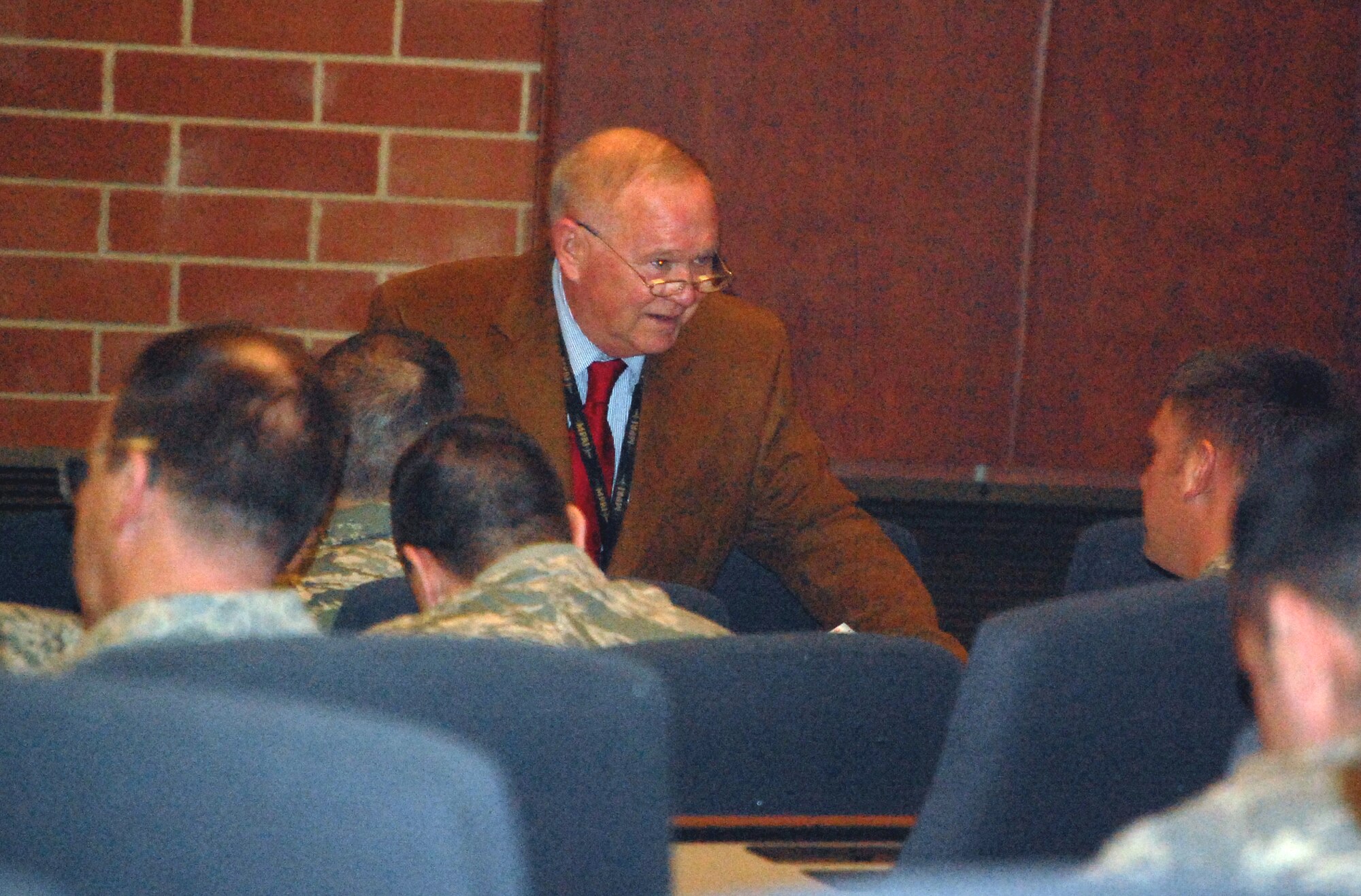 Mr. Bob Phares, a retired Air Force lieutenant colonel and manager of the Air Advisor Course, helps new students during an orientation for the course on Feb. 10, 2009, in Grace Peterson Hall in the U.S. Air Force Expeditionary Center at Fort Dix, N.J.  The Air Advisor Course trains Airmen deploying to Iraq and Afghanistan helping those countries build their own air force.  Once graduated, air advisors go on their deployments and help train foreign airmen.  (U.S. Air Force Photo/Tech. Sgt. Scott T. Sturkol)