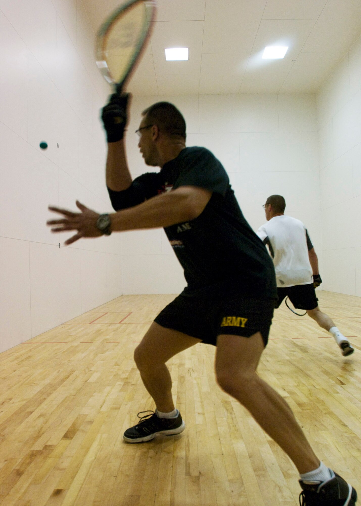 ELMENDORF AIR FORCE BASE, Alaska -- Von Auna, U.S. Army Alaska Headquarters, prepares for a backhand return during racquetball match against Scott Babos, 11th Air Force. (U.S. Air Force photo/Airman 1st Class Kristin High)
