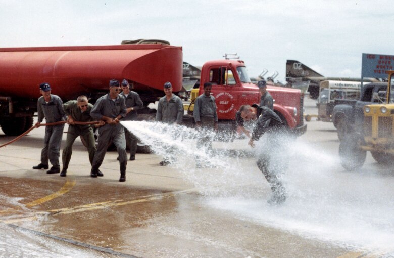 RF-4C pilot Capt. Robert Clark gets hosed down at the completion of his second 100-mission tour. (U.S. Air Force photo)