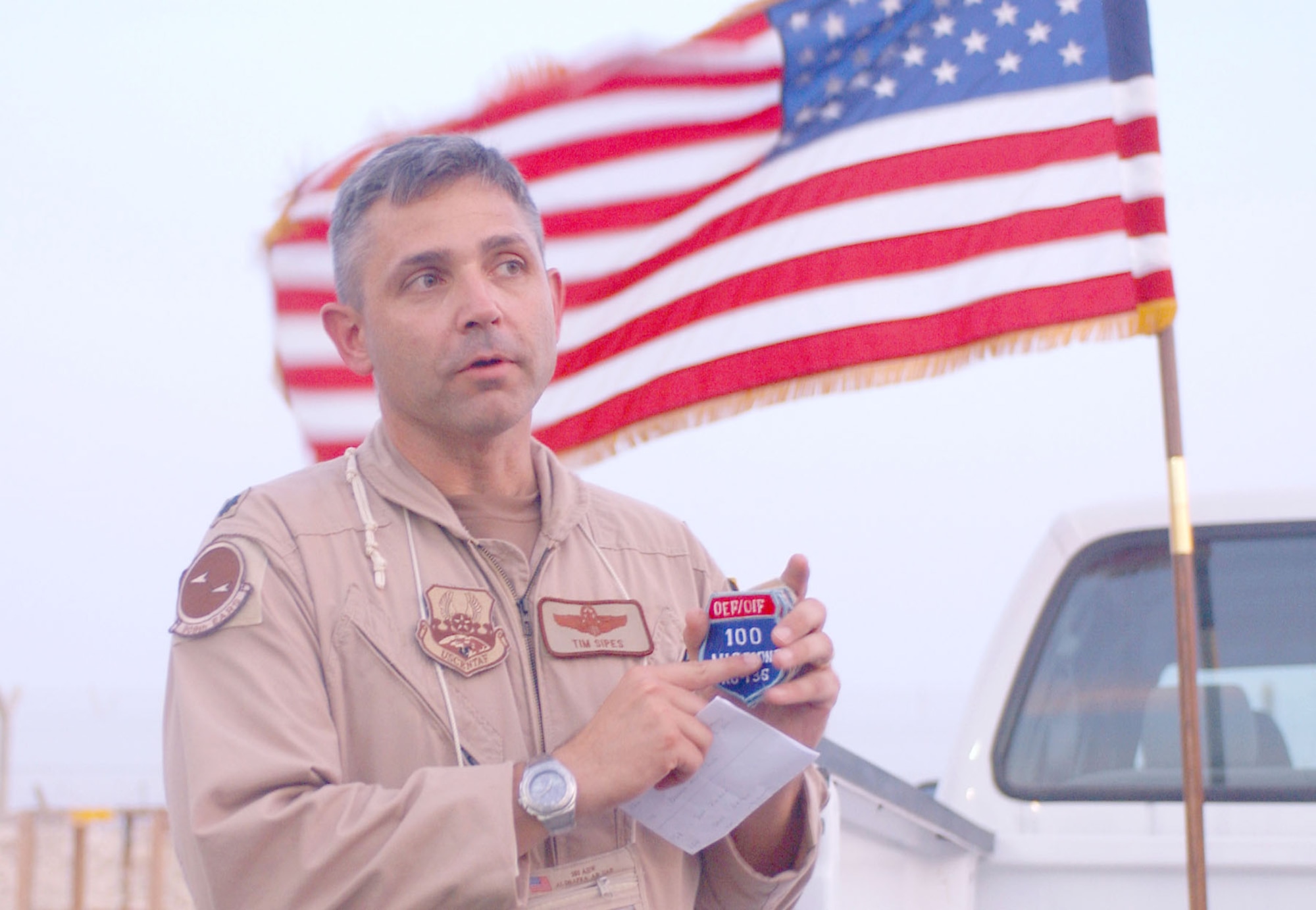 Col. Sipes awarding the first examples of this patch to his in-theater command, the 908th Expeditionary Aerial Refueling Squadron (EARS). (U.S. Air Force photo)