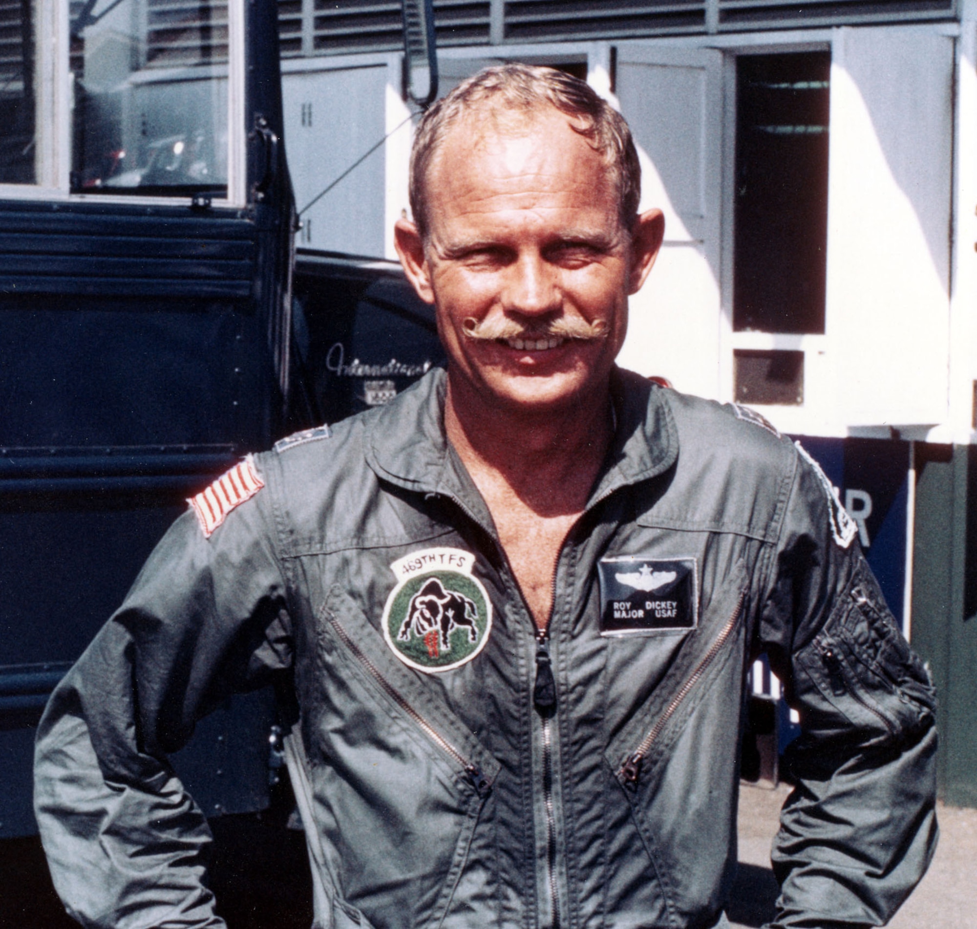 Maj. Roy Dickey, an F-105D pilot in the 469th TFS, smiling under his “bullet-proof” mustache. (U.S. Air Force photo)