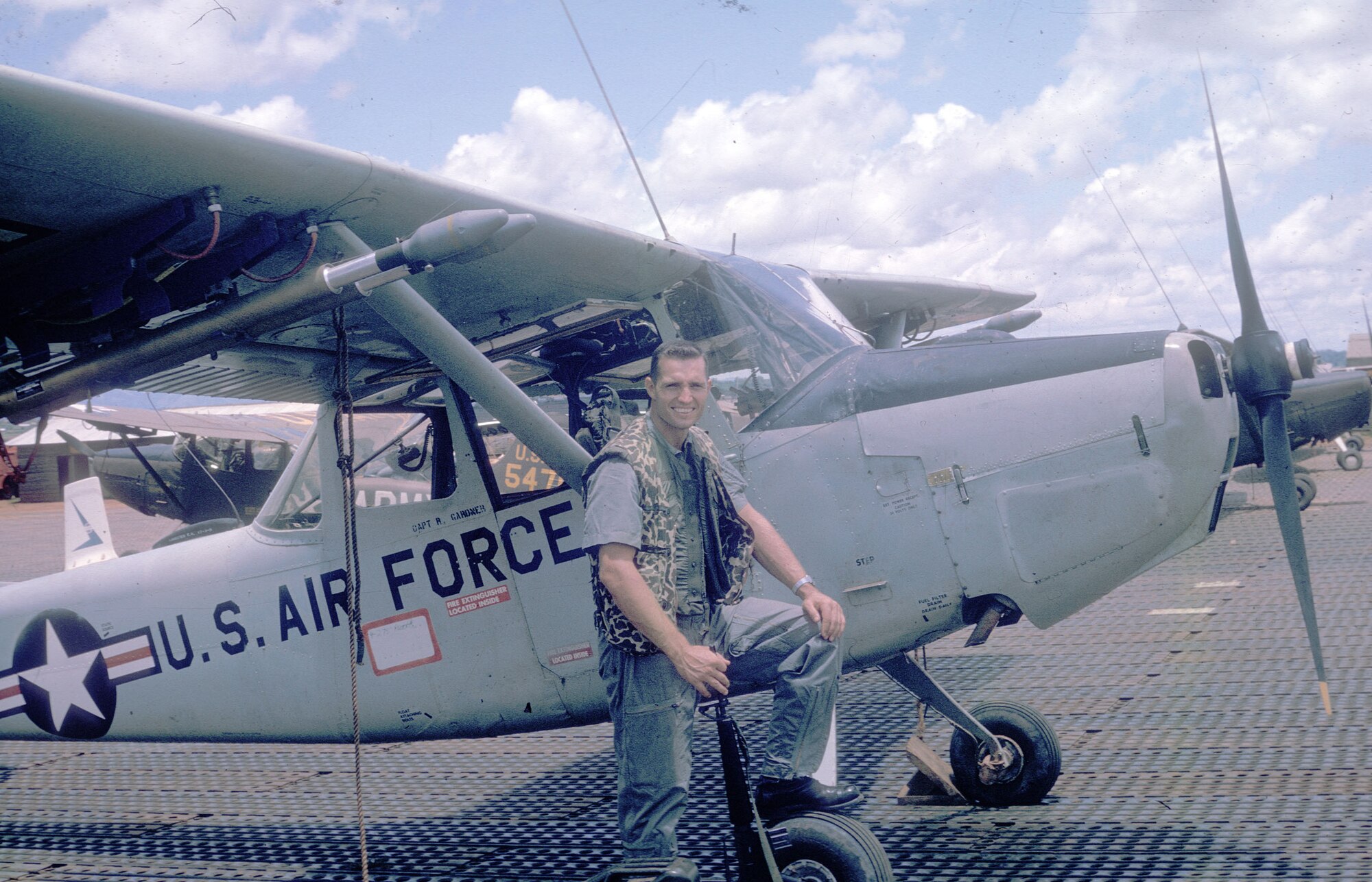Harding in front of an O-1. (U.S. Air Force photo)