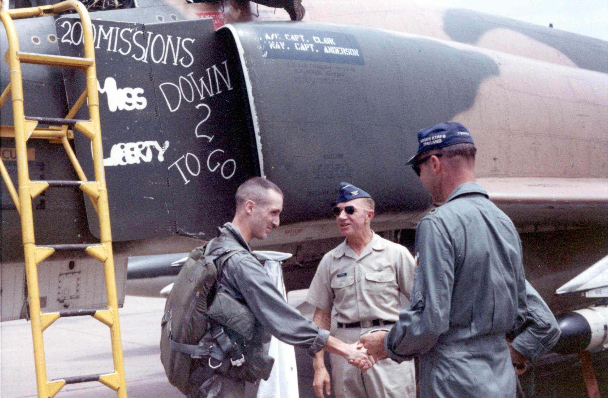 RF-4C pilot Capt. Robert Clark being congratulated after finishing his second 100-mission RF-4C tour. The “2 to go” on his aircraft represented his wish to fly two more 100-mission tours. He later flew missions as a B-52G pilot over North Vietnam during Linebacker II. (U.S. Air Force photo)