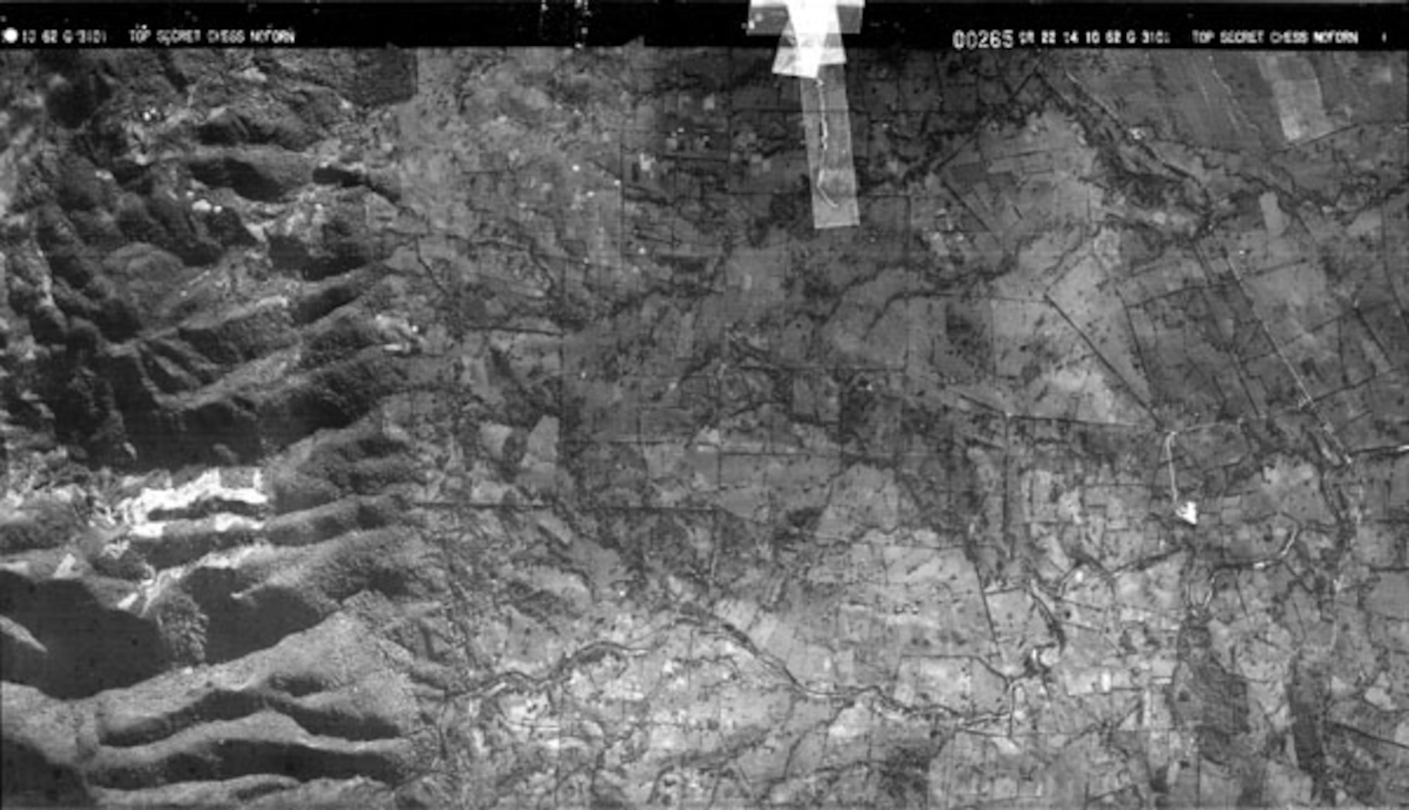 This is a duplicate photoreconnaissance camera frame from the Cuban Missile Crisis. On Oct. 16, 1962, President John F. Kennedy saw this image, and a photo interpreter explained to him, “Mr. President, I am as sure of this as a photo interpreter can be of anything ... I am convinced they are missiles.” The image was taken by a USAF U-2 on Oct. 14 and was one of the first to show that Soviet missiles were in Cuba. The frame covers an area 4 miles wide and 8 miles long, and was taken at an altitude of about 70,000 feet. The title “CHESS” (on the upper part of the picture) is the code name for U-2 photography, and “NOFORN” means no foreigners were allowed to see the film. (U.S. Air Force photo)