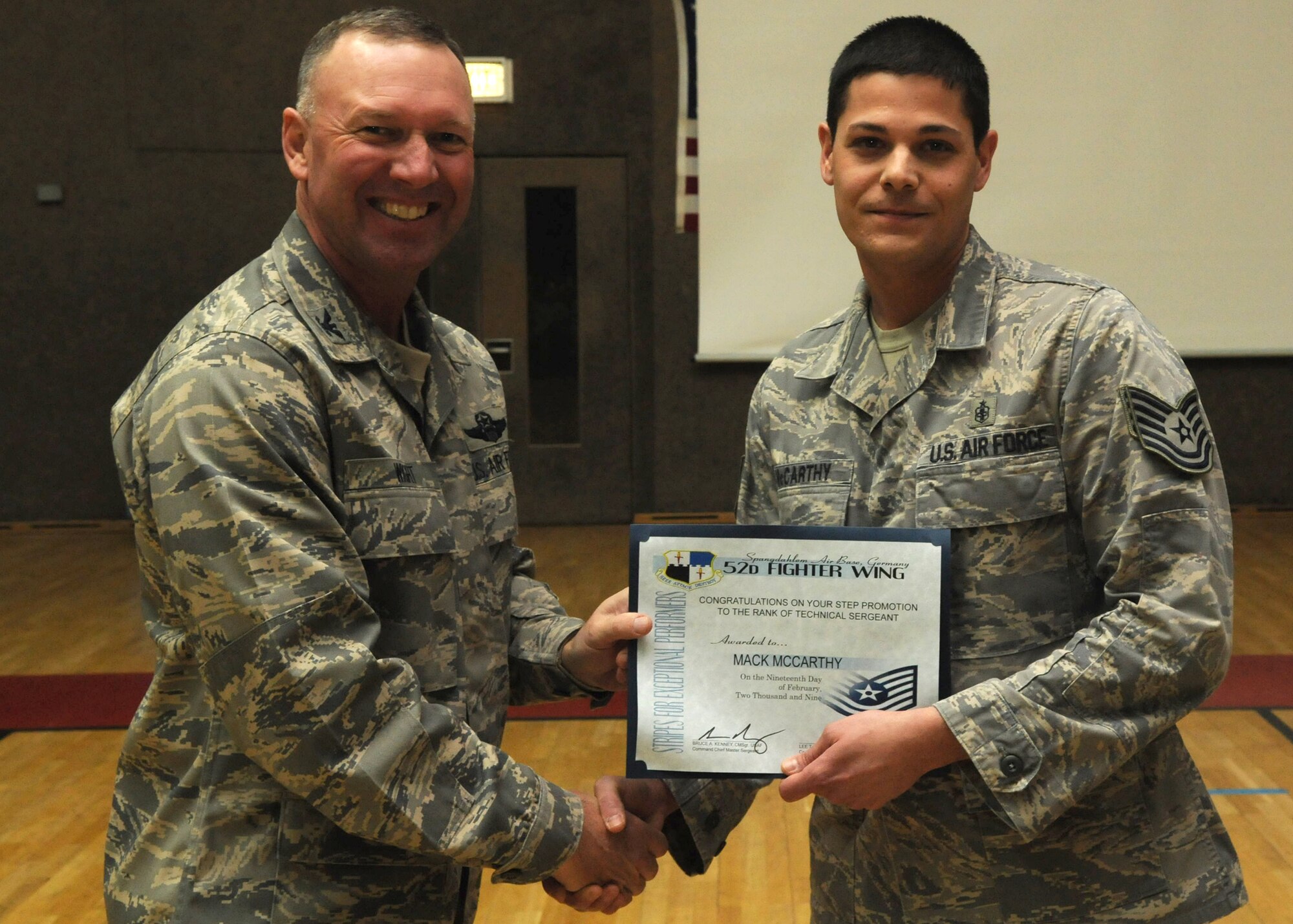 SPANGDAHLEM AIR BASE, Germany – Tech. Sgt. Mack McCarthy, 52nd Medical Operations Squadron, is congratulated by Col. Lee Wight, 52nd Fighter Wing commander, for achieving a Stripes for Exceptional Performers Promotion to technical sergeant Feb. 20, 2009. Each year a limited number of Airmen receive a STEP promotion for continually doing outstanding work. (U.S. Air Force photo by Airman 1st Class Nicholas Wilson)