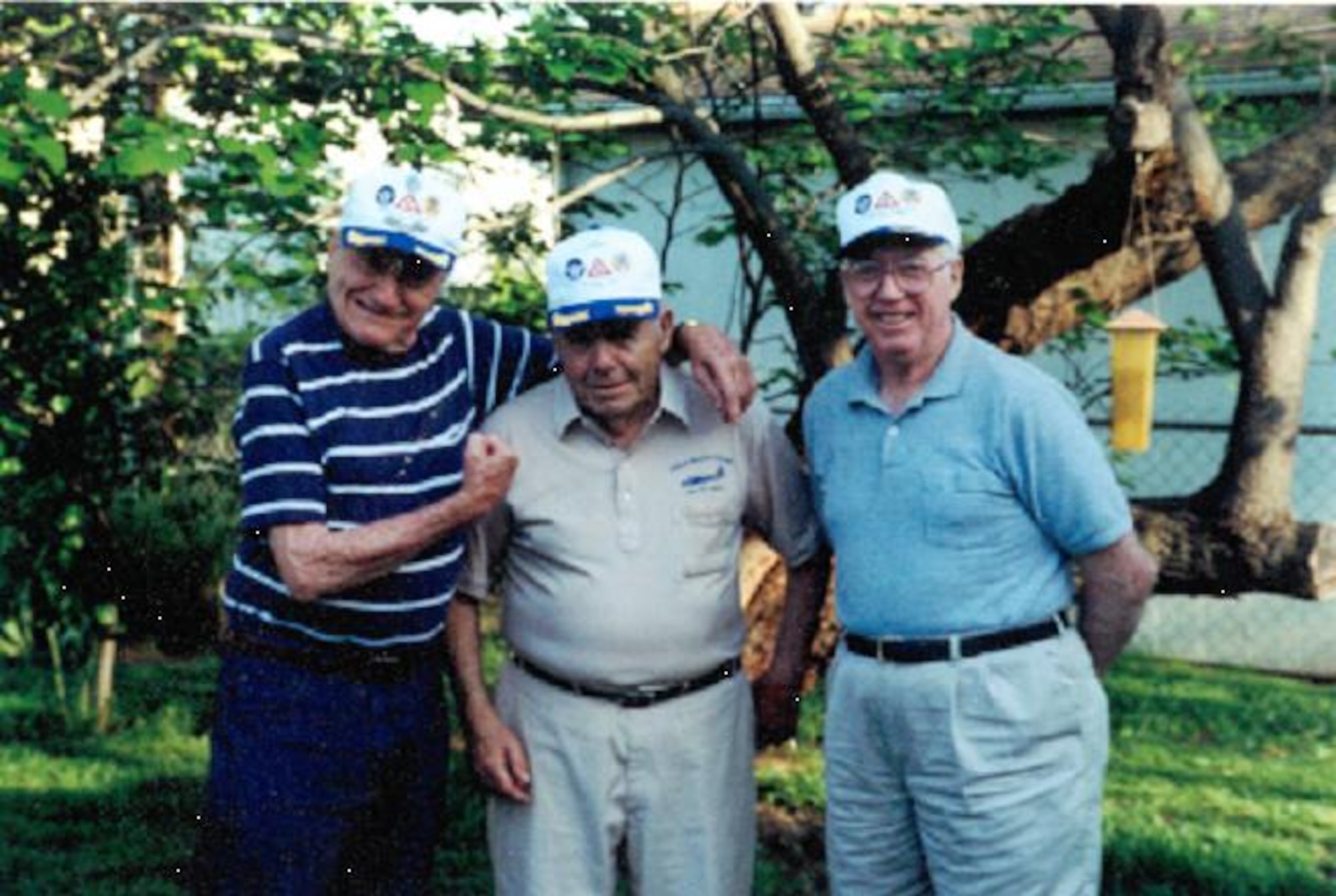 Former U.S. Army Air Corps B-17 "Flying Fortress" ball turret gunner Earl F. "Frank" Ingalls reunites with his former pilot Arthur Lorentz on the left and his former radioman Walt Ringen in 1999.  Former First Lieutenant Lorentz presented Cpl. Ingalls with a piece of flak extracted from the ball turret in which he was wounded during his thirty-fourth mission in 1944. (Photo courtesy of Ms. Tami Rager)