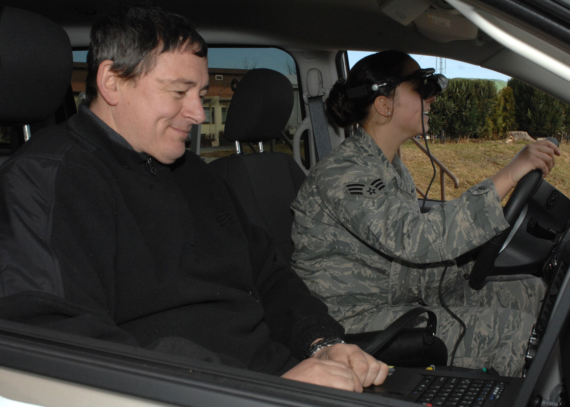 SPANGDAHLEM AIR BASE, Germany -- Senior Airman Malory Bullocks, 52nd Civil Engineer Squadron, witnesses the effects of drunken driving in the Exchange New Car Sales Drive Smart Drunk Driving Education simulator as Pete Kotowski, Exchange New Car Sales, enters data into the simulator Feb. 19, 2009.  The simulator demonstrates the age of driver, size, sex and how many drinks a person has had within a certain period to show Airman the effects of drinking under the influence of alcohol.  (U.S. Air Force photo by Senior Airman Jenifer H. Calhoun)
