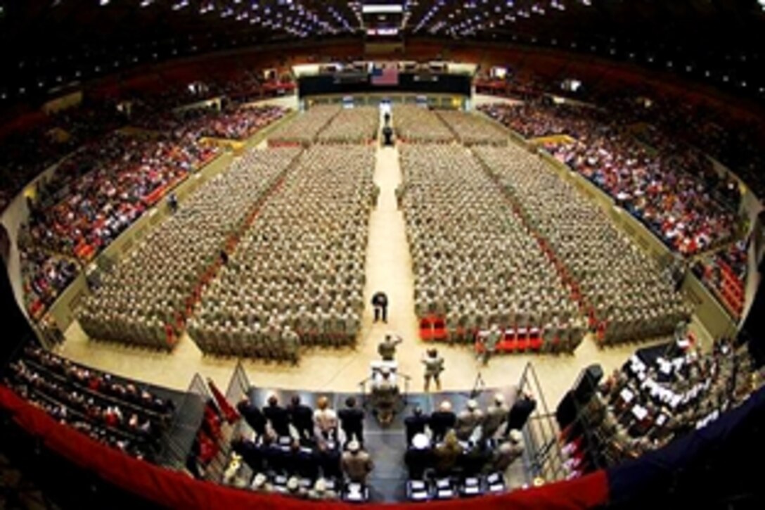 U.S. Army Command Sgt. Maj. Ed Hansen, in front of podium, accepts reports from battalion leaders during a send-off ceremony at the Dane County Veterans Memorial Coliseum in Madison, Wis., Feb. 17, 2009. Wisconsin is deploying its largest force since World War II. The unit is bound for training on Fort Bliss, Texas, followed by deployment to Iraq.