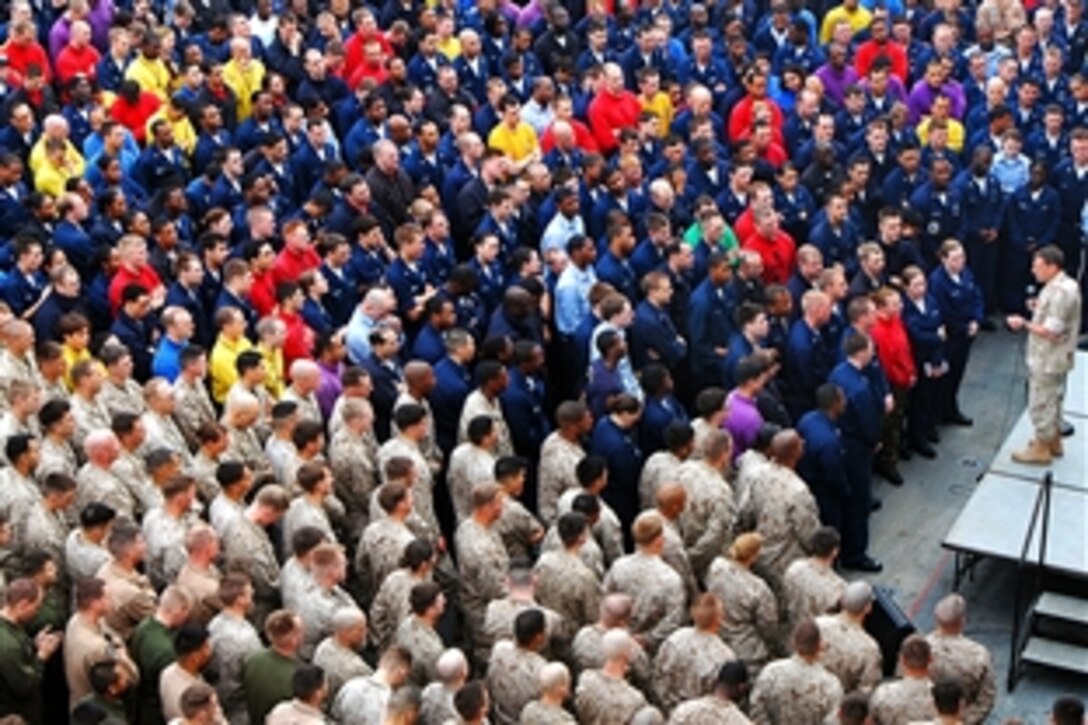 U.S. Navy Vice Adm. Bill Gortney, commander, U.S. Naval Forces Central Command and U.S. 5th Fleet, speaks to sailors and Marines during an all-hands call on the flight deck of amphibious assault ship USS Iwo Jima under way in the Persian Gulf, Feb. 17, 2009.