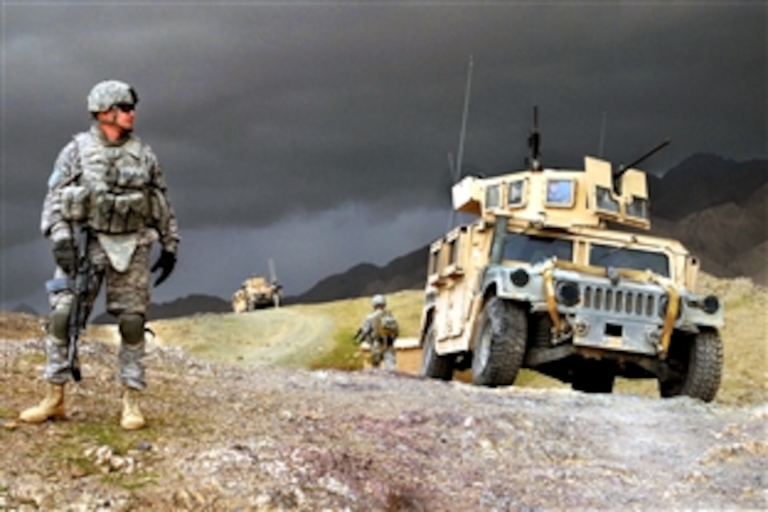 U.S. Army 1st Lt. Larry Baca monitors the weather outside as a storm approaches Forward Operation Base Lane, Afghanistan, Feb. 19, 2009. Baca is assigned to Company C, 1st Battalion, 4th Infantry Regiment.