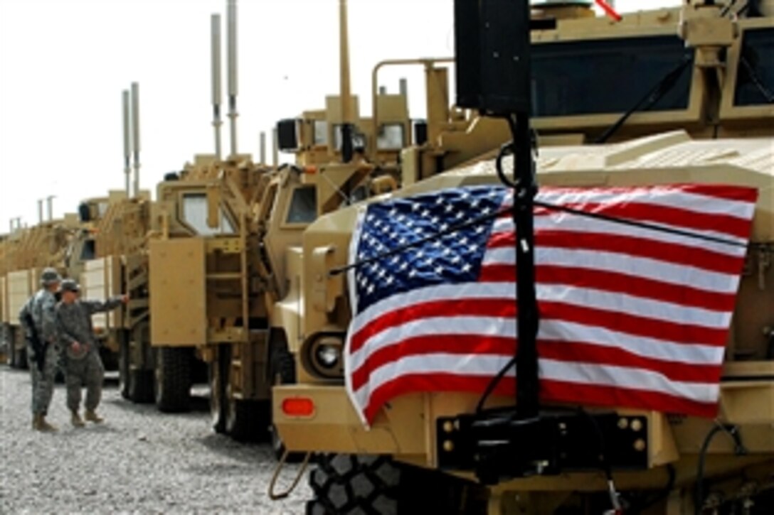 Mine resistant ambush protected vehicles sit in a row on the Camp Liberty MRAP fielding site, Feb. 20, 2009. The day marks the introduction of the 10,000th vehicle into the Iraq theater of operations. 