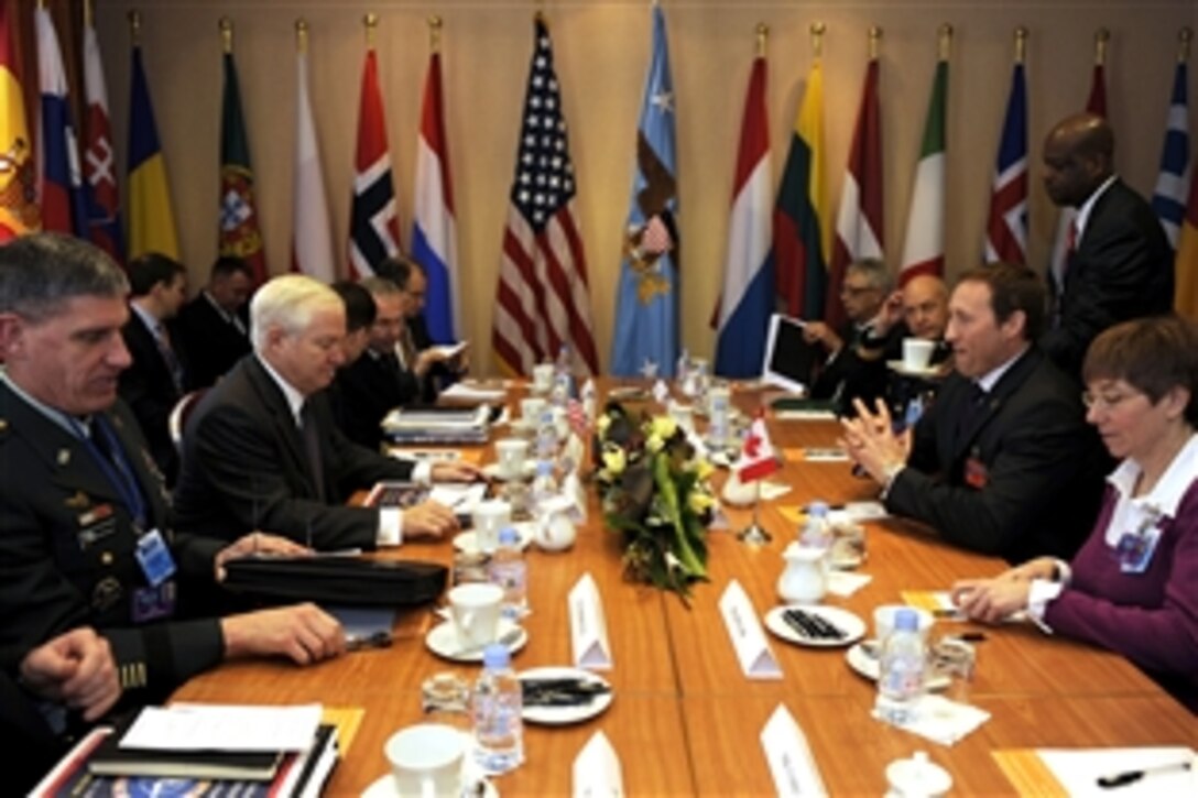 U.S. Defense Secretary Robert M. Gates, second from left, conducts a meeting with Canadian Defense  Minister Peter MacKay, second from right, during the Krakow Defense Ministerial Conference in Krakow, Poland, Feb. 20, 2009.