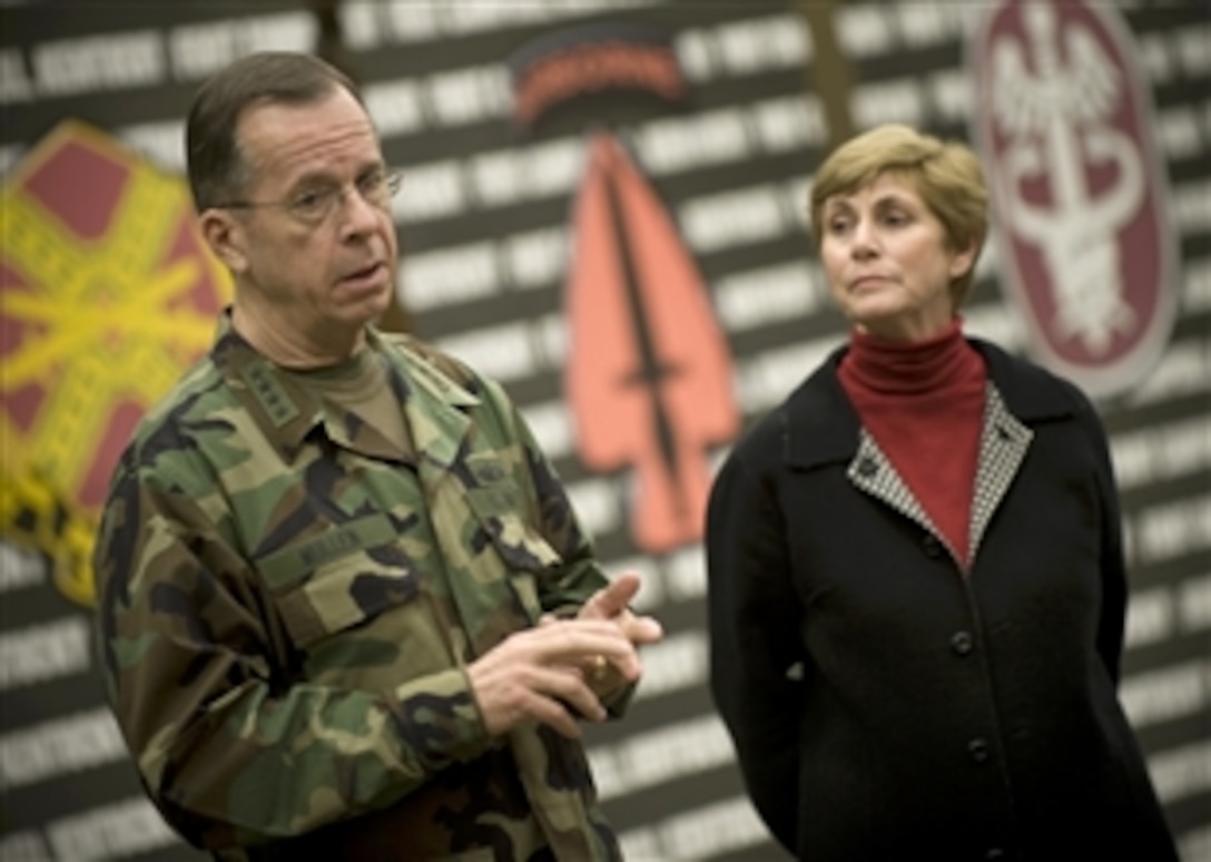 U.S. Navy Adm. Mike Mullen, chairman of the Joint Chiefs of Staff, and his wife Deborah address spouses of soldiers assigned to Fort Campbell, Ky., during a town hall meeting on an installation, Feb. 20, 2009. The Mullens are wrapping up visits to Minot and Scott Air Force Bases and Campbell visiting with troops on the bases.