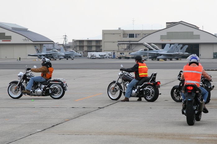 Students practice stopping and starting drills during the practical portion of the Basic Riders Course. The Basic Riders Course is taught each week at the station safety center for classroom instruction and at a designated area on the flight line for practical instruction.
