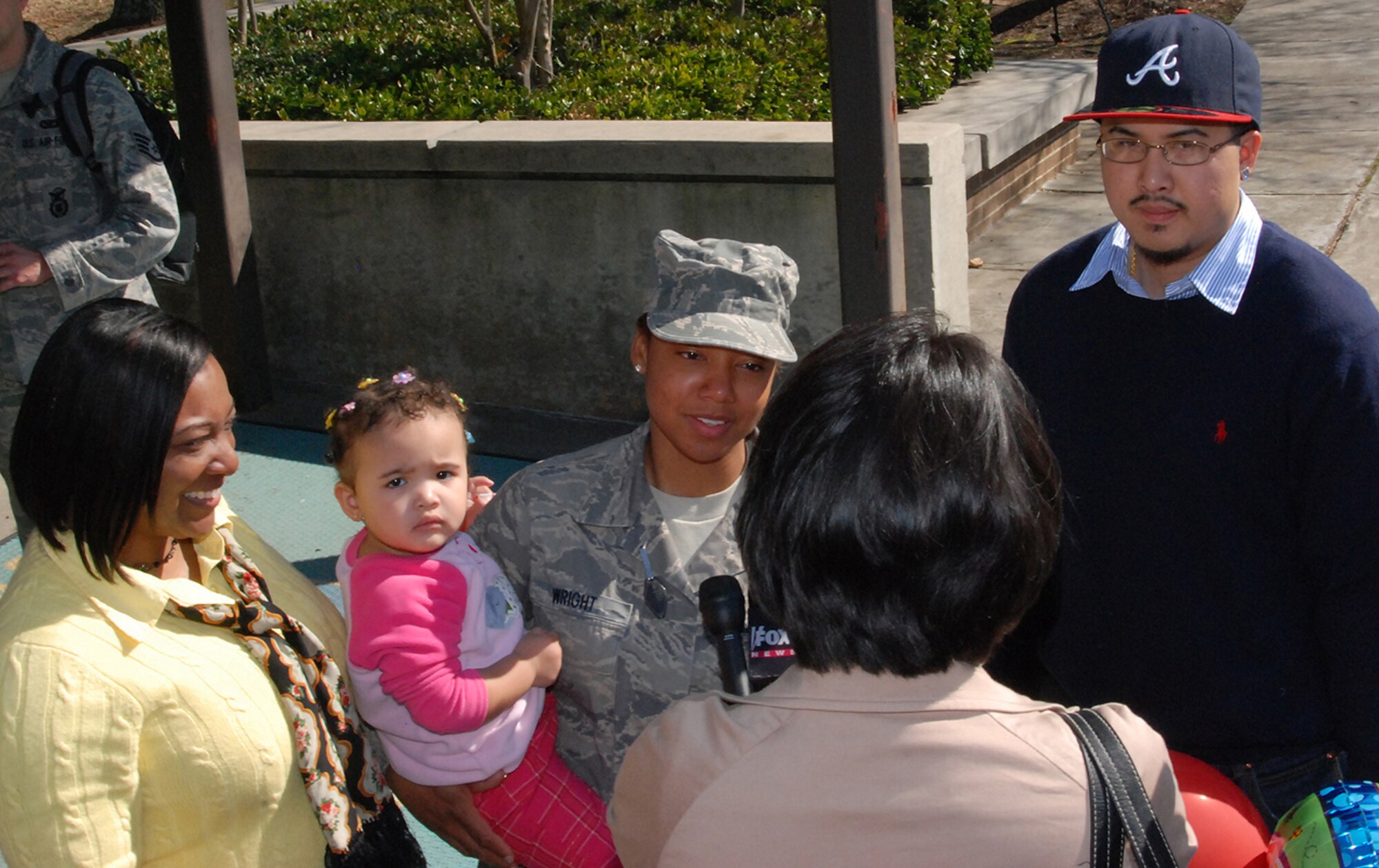 Dobbins Air Reserve Base, Ga. - FOX 5-TV News reporter interviews Senior Airman Loyisha Wright and family after arrival from Southwest Asia. "It's good to see family again," she said.   Airman Wright was deployed with about 26 Airmen of the 94th Security Forces Squadron to Iraq in support of Operation Iraqi Freedom.