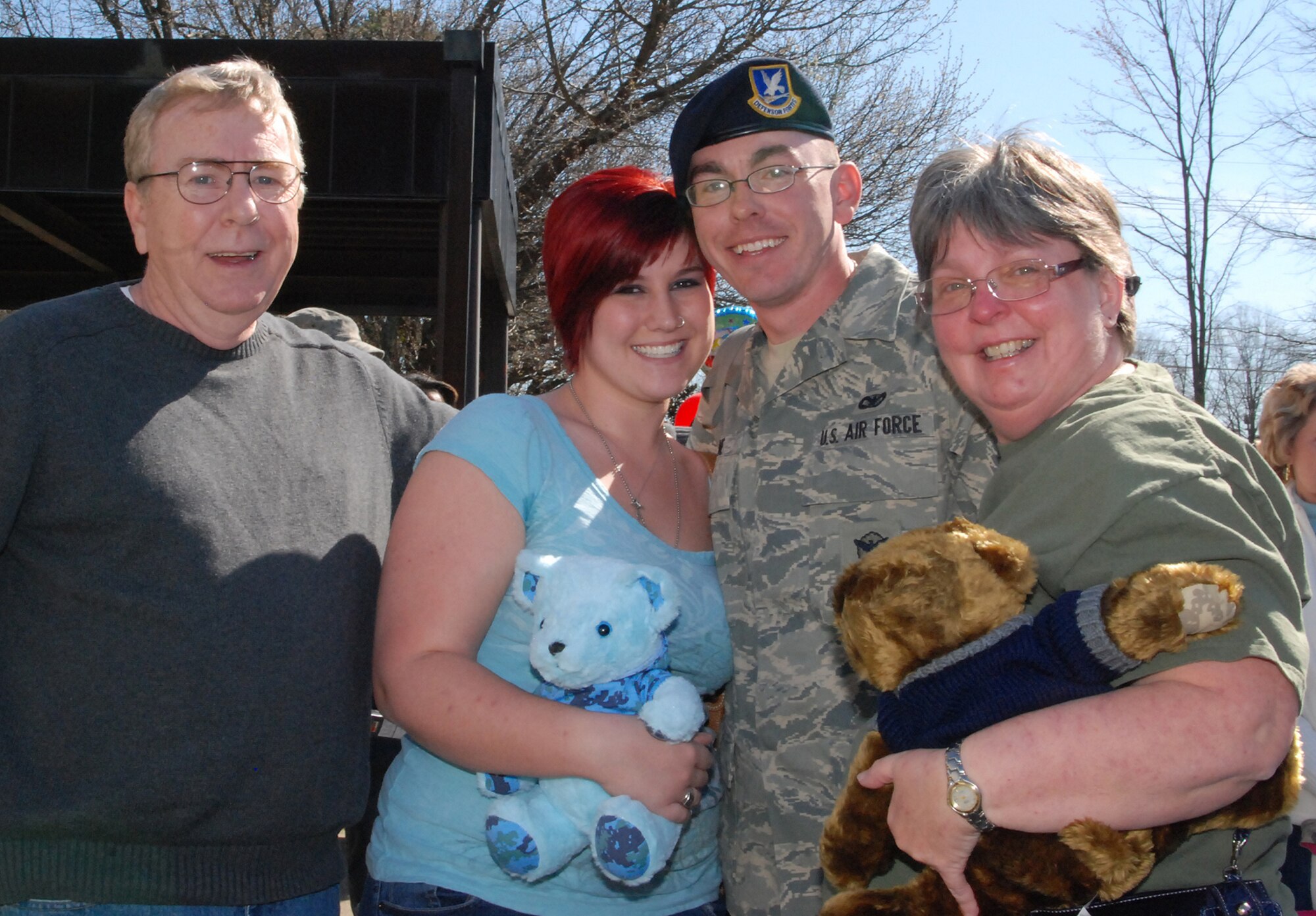 Dobbins Air Reserve Base - Senior Airman Brian Irvine is all smiles from a family and girlfriend welcome after his arrival home from Southwest Asia.  "I can't wait to get a Varsity chili dog," he said.  Airman Irvine was deployed with more than 20 Airmen of the 94th Security Forces Squadron in Iraq in support of Operation Iraqi Freedom.  