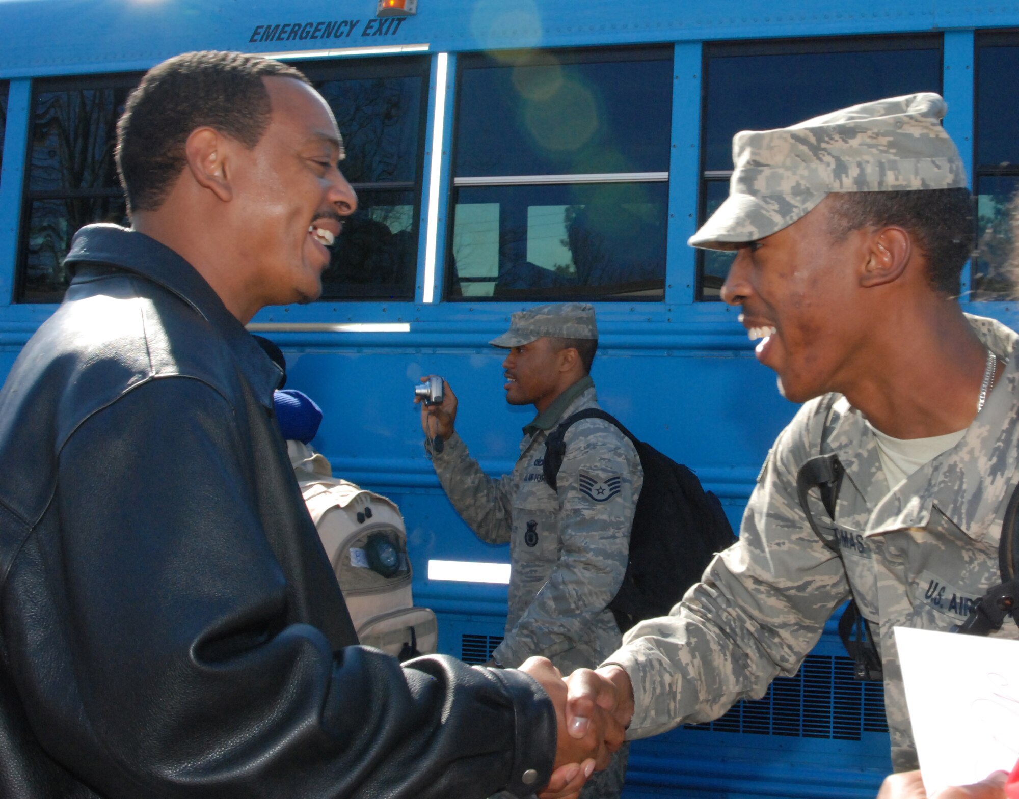 Dobbins Air Reserve Base, Georgia - Mr. Maurice Thomas Sr. welcomes his son, Senior Airman Maurice Thomas Jr. from his six-month deployment to Iraq.  "It's good to see family again," said Airman Thomas.  Airman Thomas was deployed with about 26 Airmen of the 94th Security Forces Squadron to Iraq in support of Operation Iraqi Freedom.  