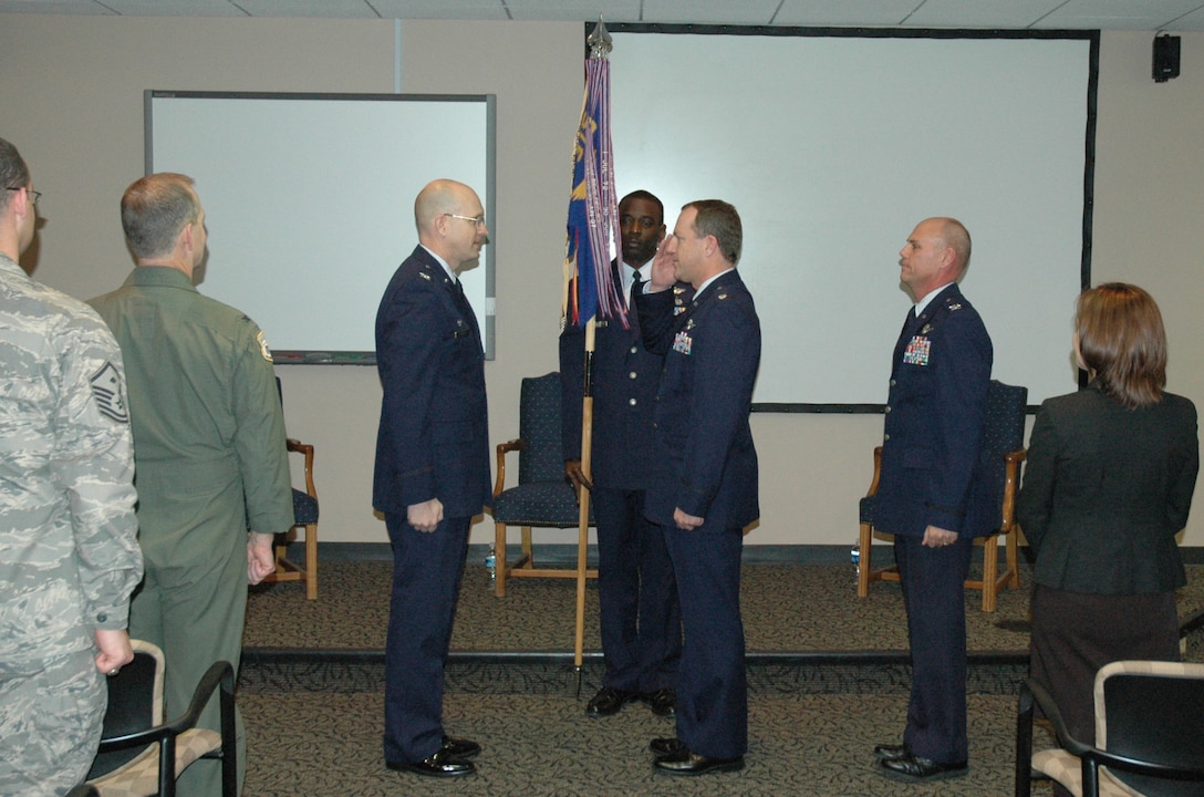 Lt. Col. Bob Graham assumes command of the 300th Airlift Squadron from Col. Jay Jensen, 315th Operations Group commander, at a change of command ceremony Saturday.  