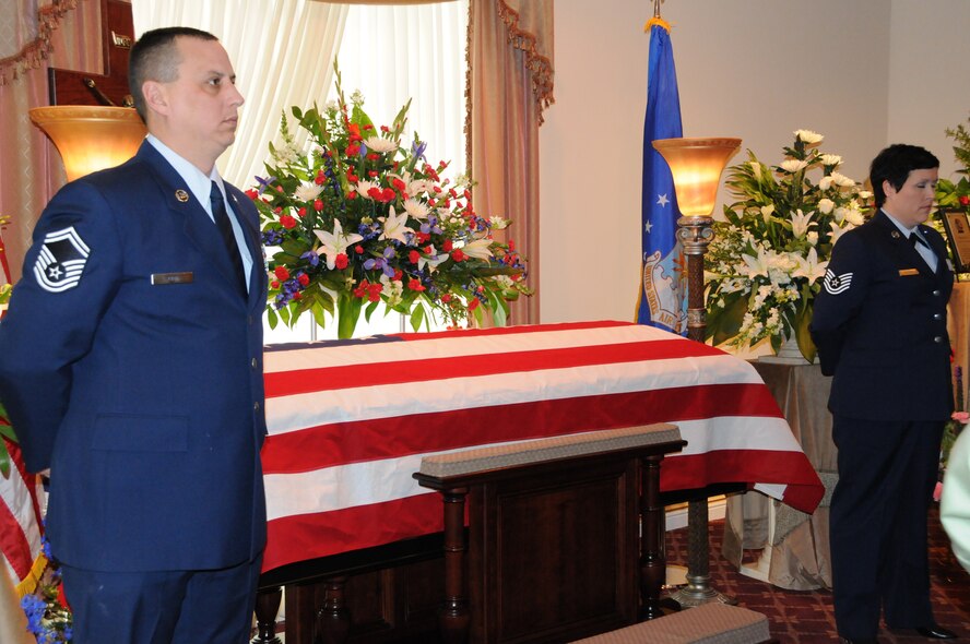 NIAGARA FALLS AIR RESERVE STATION, N.Y. - Senior Master Sgt. Ryan King (left) and Tech. Sgt. Pam Rickard (right), from the 30th Aerial Port Squadron stand as honor guards beside the casket of Chief Master Sgt. (retired) John Fiore of the 914th Airlift Wing, U.S. Air Force Reserve.  Chief Fiore was tragically killed in the crash of Continental Airlines Flight 3407 on February 12, 2009.  A tremendous amount of support for the family of Chief Fiore was evident during the memorial service by both military and the civilian populace.  (U.S. Air Force photo by Master Sgt. Peter Borys)