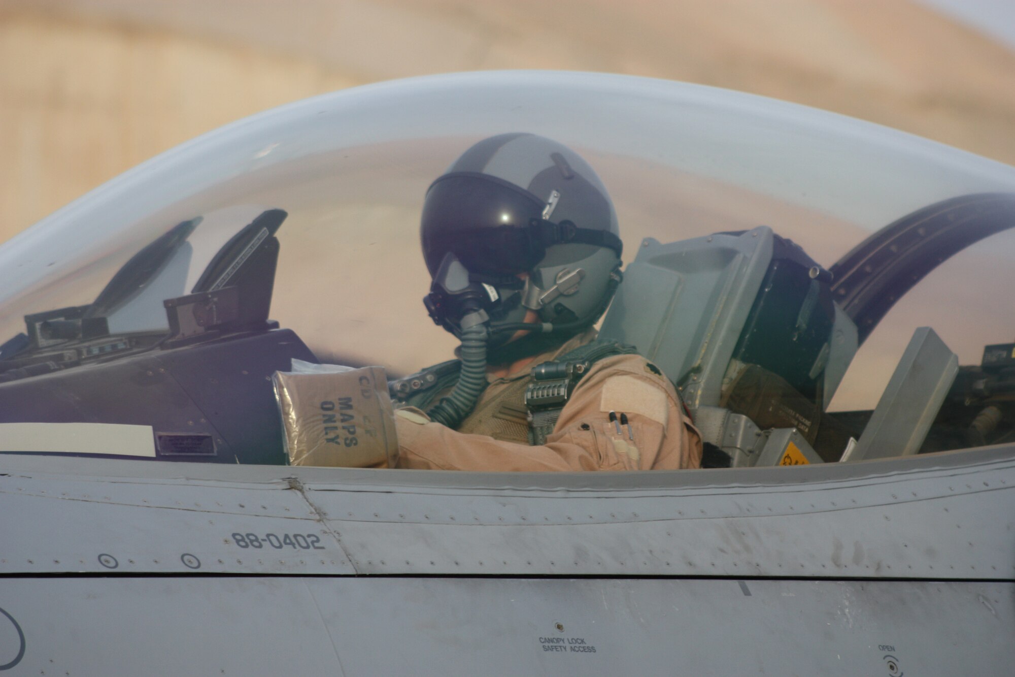 JOINT BASE BALAD, Iraq -- Lt. Col. David Smith, 332nd Expeditionary Fighter Squadron commander, prepares to take off here Feb. 8 with a silk map that last flew in World War II during a bombing mission over Germany. Smith is deployed from Homestead Air Reserve Base, Fla., and his hometown is Miami. (U.S. Air Force photo/Tech. Sgt. Lionel Castellano)
