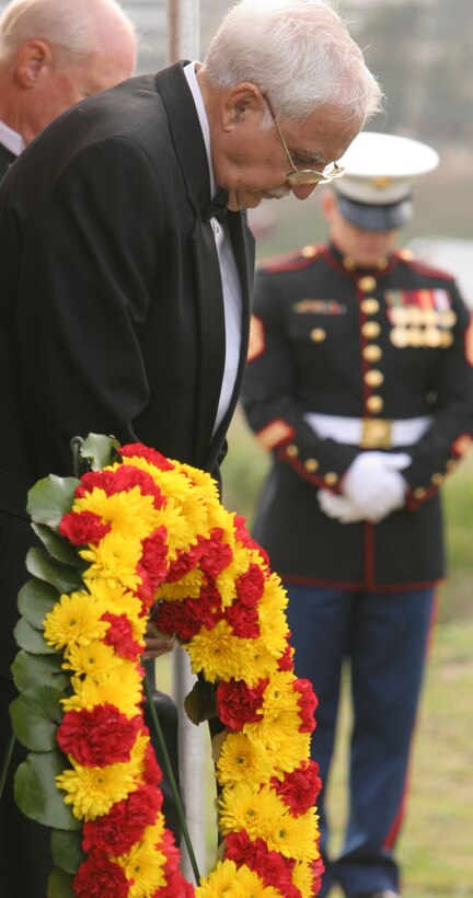 Joe Garza, former Marine and Iwo Jima survivor, bows his head in reverence during a ceremony commemorating 64 years since the historic battle on Iwo Jima, held at the South Mesa Club, Saturday. Garza was one of hundreds who attended the three-hour ceremony, which was filled with stories of survivors reliving the gruesome battle, a wreath laying and the time honored 21-gun salute. The ceremony was followed by a reception, dinner and dance.