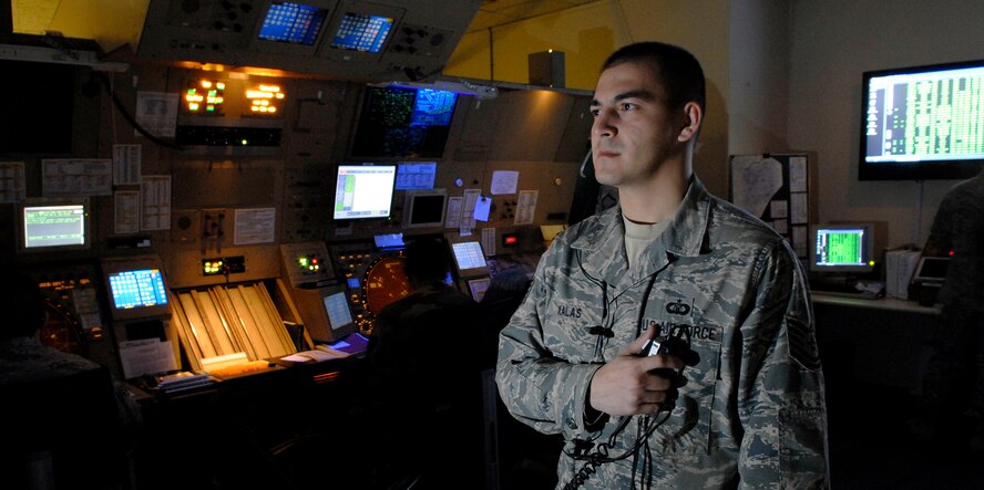 Tech. Sgt. Norbert Kalas talks with inbound aircraft at the radar approach control Feb. 18 at Osan AB, Republic of Korea.  The RAPCON controls aircraft at altitudes up to 14,000 feet, with a 40-mile radius from the base.  Sergeant Kalas is an air traffic controller with the 51st Operations Support Squadron. (U.S. Air Force Photo/Staff Sgt. Brian Ferguson)