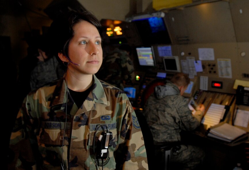Staff Sgt. Kristin Dobson waits for a call from an inbound aircraft at radar approach control Feb. 18 at Osan AB, Republic of Korea.  The RAPCON controls aircraft landing at altitudes almost 14,000 feet and a 40-mile radius from the base.  Senior Airman Hatfield is an air traffic controller with the 51st Operations Support Squadron. (U.S. Air Force Photo/Staff Sgt. Brian Ferguson)