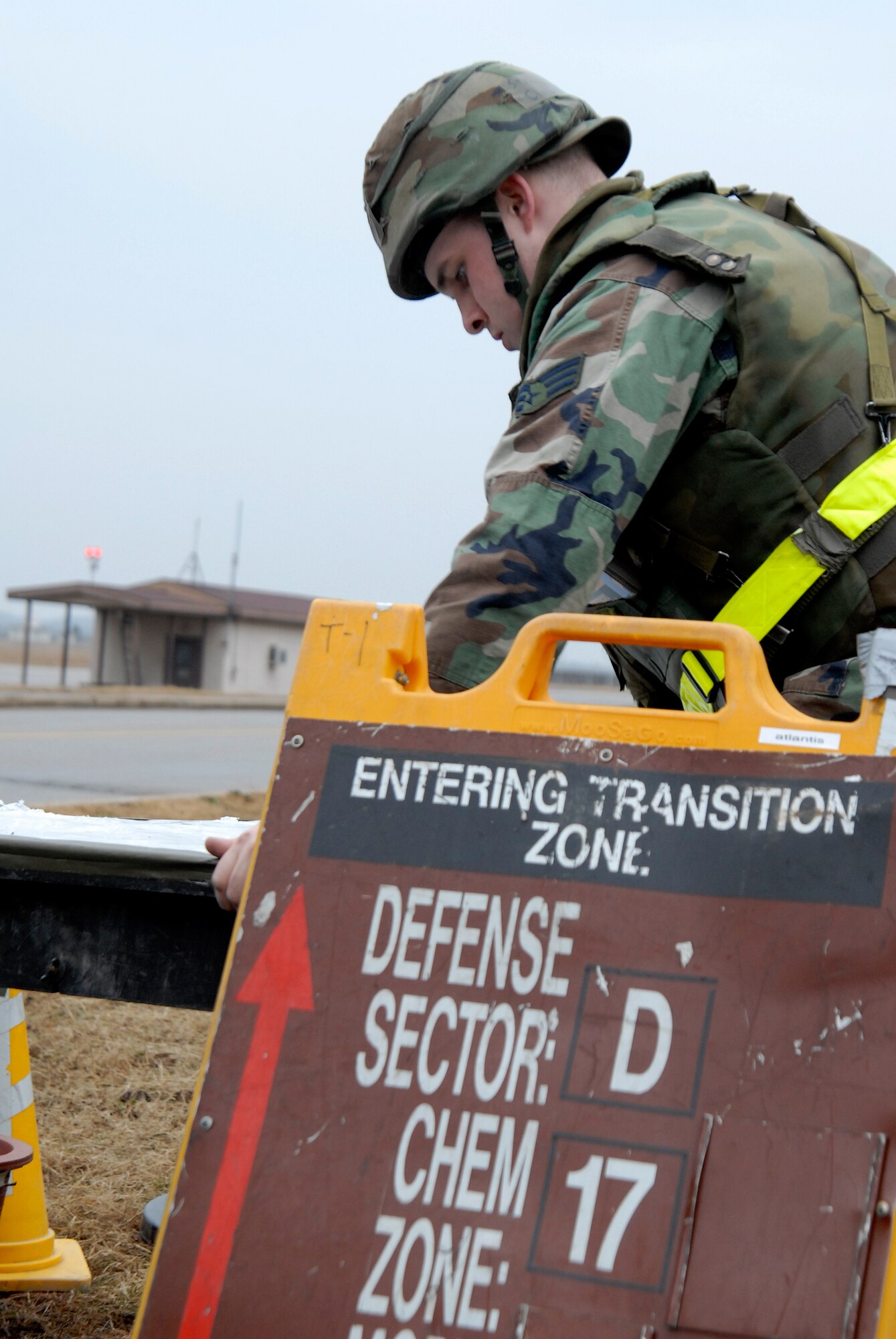 Senior Airman Christopher Clazie, working with the 8th Security Forces Squadron, sets up a zone transition point during a local operational readiness exercise at Kunsan Air Base, Republic of Korea, Feb. 22, 2009. The local exercise, Beverly Midnight 09-01, is testing the wing's ability to effectively operate in simulated wartime contingencies. (U.S. Air Force Photo by SSgt Jason Colbert)