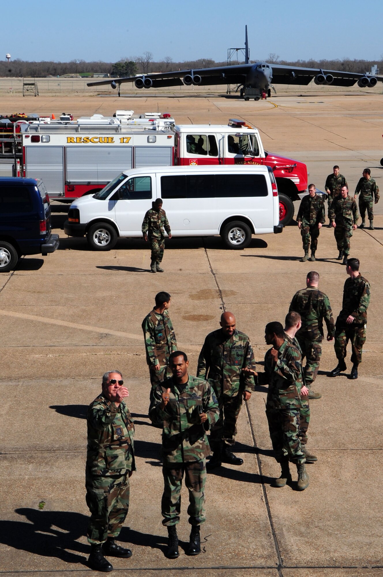 Barksdale fire department members assemble near a KC-135 prior to a safety lesson. (U.S. Air Force photos by Senior Airman Joanna M.Kresge, 2nd Bomb Wing Public Affairs)