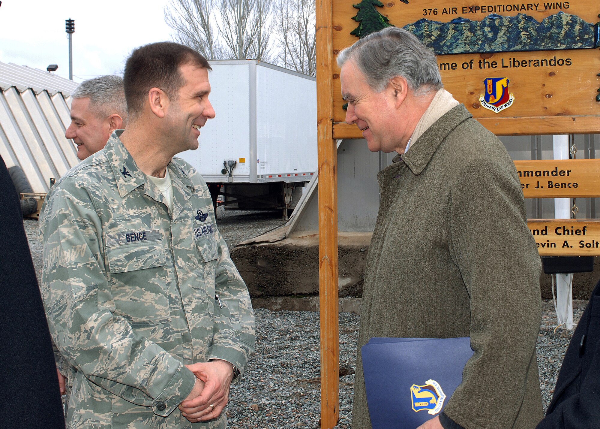 Col. Christopher Bence, 376th Air Expeditionary Wing commander enjoys a laugh with Ambassador Pierre Morel, European Union Special Representative to Central Asia, during a visit at Manas Air Base, Kyrgyzstan, Feb. 21. A five-person delegation led by Ambassador Morel received a tour of the air mobility hub and a wing mission brief during their visit. Coalition personnel from 25 EU countries transit through Manas in support of the International Security Assistance Force in Afghanistan. (U.S. Air Force photo/Tech. Sgt. Elizabeth Weinberg)