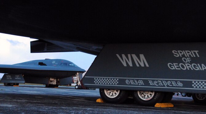 Two B-2s from the 509th Wing at Whiteman Air Force Base taxi onto the parking ramp at Andersen Air Force Base Guam, Feb.23.  More than 250 Airmen and four B-2 Spirits, deployed from Whiteman Air Force Base, Mo., began arriving here Feb. 23, to replace the 23rd Expeditionary Bomb Squadron and its B-52 Stratofortress as the Pacific regions  Continuous U.S. Bomber Presence.
(U.S. Air Force photo by Senior Airman Ryan Whitney)  
