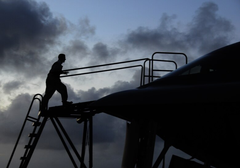 A 36th Expeditionary Maintenance Squadron crew chief, conducts post flight maintenance on a B-2 Spirit after its arrival at Andersen Air Force BAse,  Guam Feb. 23.  More than 250 Airmen and four B-2 Spirits, deployed from Whiteman Air Force Base, Mo., began arriving here Feb. 23, to replace the 23rd Expeditionary Bomb Squadron and its B-52 Stratofortress as the Pacific regions Continuous U.S. Bomber Presence.(U.S. Air Force photo by Senior Airman Ryan Whitney) 