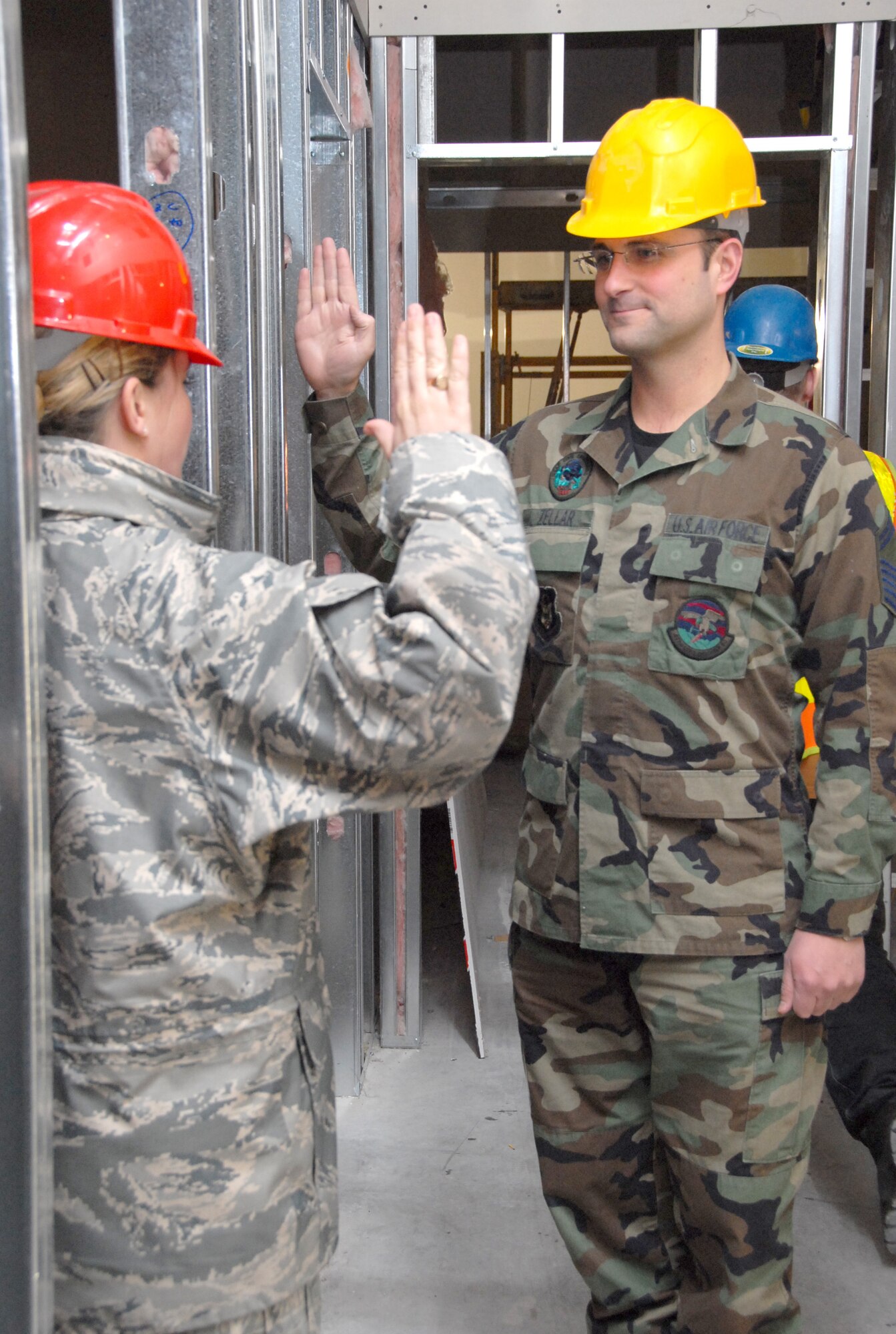 ELMENDORF AIR FORCE BASE, Alaska -- Senior Master Sgt. Tim Zellar, 477th Civil Engineer Squadron reenlists Feb. 17.  Sgt. Zellar is the first Reservist to reenlist in the new 477th Fighter Group Headquarters.  The building is scheduled to be complete by Sept. 2009.  When complete the headquarters will house approximately 425 Air Reserve Technician and Traditional Reservists.  The 477 FG is a Classic Associate unit responsible for recruiting, training, developing and retaining unrivaled Citizen Airmen. (US Air Force Photo by Staff Sgt. Rhiannon Willard)
