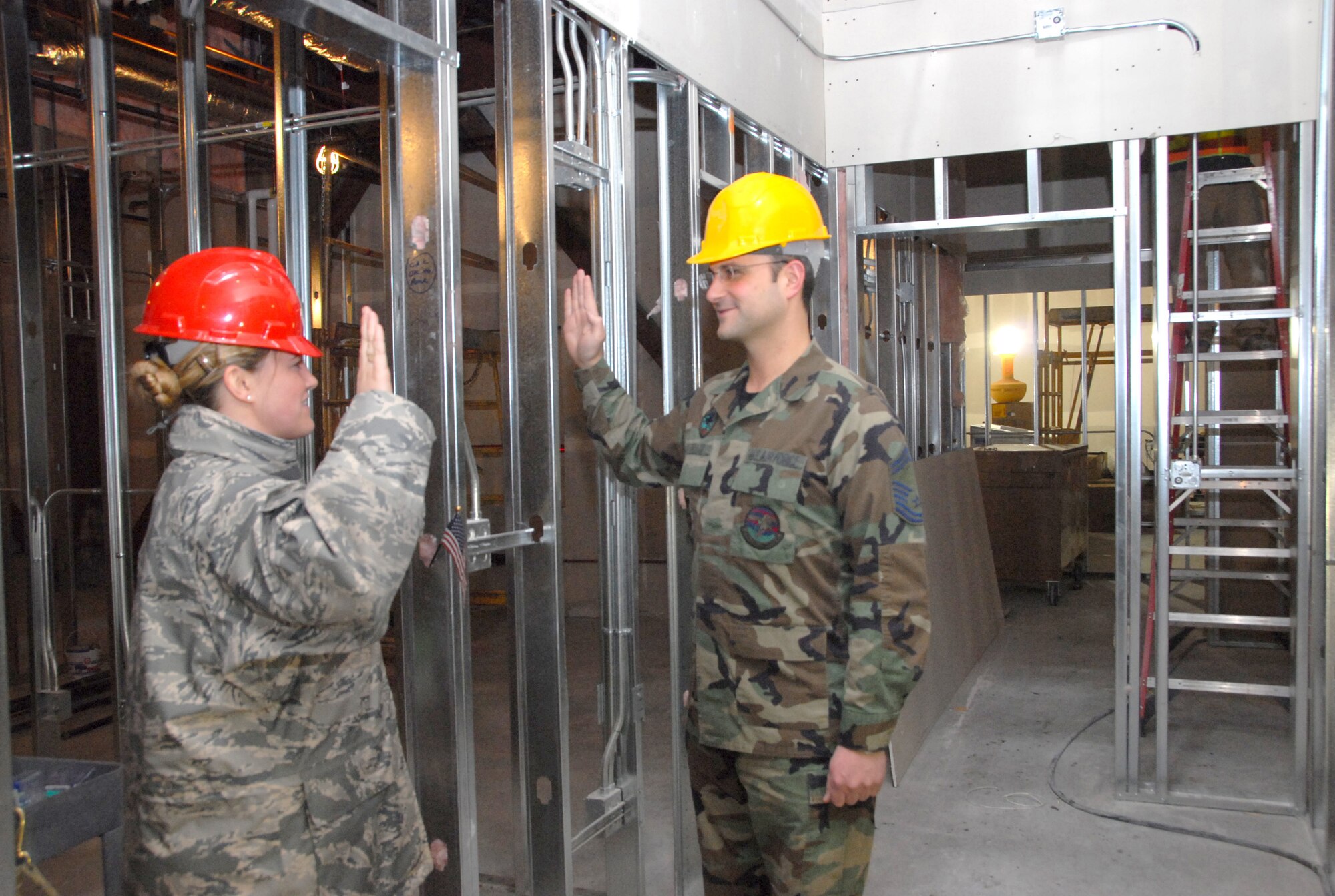 ELMENDORF AIR FORCE BASE, Alaska -- Senior Master Sgt. Tim Zellar, 477th Civil Engineer Squadron reenlists Feb. 17.  Sgt. Zellar is the first Reservist to reenlist in the new 477th Fighter Group Headquarters.  The building is scheduled to be complete by Sept. 2009.  When complete the headquarters will house approximately 425 Air Reserve Technician and Traditional Reservists.  The 477 FG is a Classic Associate unit responsible for recruiting, training, developing and retaining unrivaled Citizen Airmen. (US Air Force Photo by Staff Sgt. Rhiannon Willard)