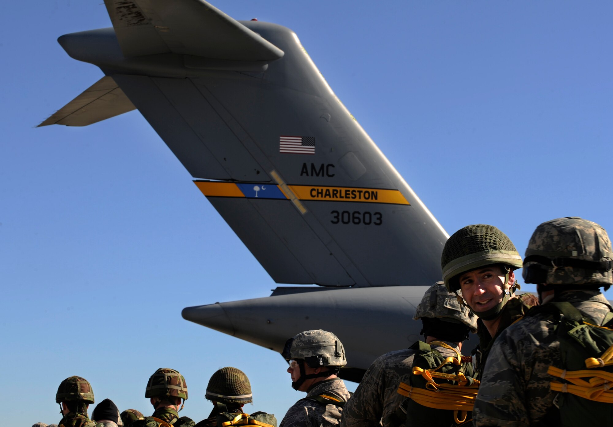 MOODY AIR FORCE BASE, Ga. -- Members of the 820th Security Forces Group and the II Squadron Royal Air Force from RAF Honington in Suffolk, Great Britain, prepare to board a C-17 Globemaster III for static line parachute jump here Feb. 5. Operation Winged Eagle covered training events ranging from simulated munitions to airborne operations. (U.S. Air Force photo by Senior Airman Brittany Barker)
