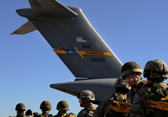 MOODY AIR FORCE BASE, Ga. -- Members of the 820th Security Forces Group and the II Squadron Royal Air Force from RAF Honington in Suffolk, Great Britain, prepare to board a C-17 Globemaster III for static line parachute jump here Feb. 5. Operation Winged Eagle covered training events ranging from simulated munitions to airborne operations. (U.S. Air Force photo by Senior Airman Brittany Barker)

