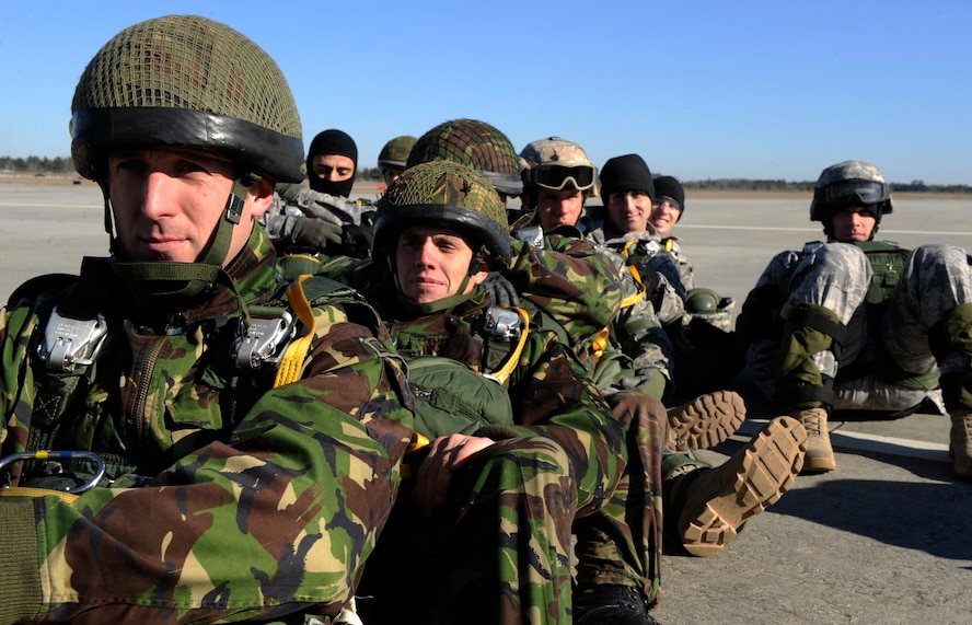 MOODY AIR FORCE BASE, Ga. -- Members of the 820th Security Forces Group and the II Squadron Royal Air Force Regiment from RAF Honington in Suffolk, Great Britain, wait to board a C-17 Globemaster III during a joint exercise here Feb. 5. Operation Winged Eagle covered training events ranging from simulated munitions to airborne operations. (U.S. Air Force photo by Senior Airman Brittany Barker)
