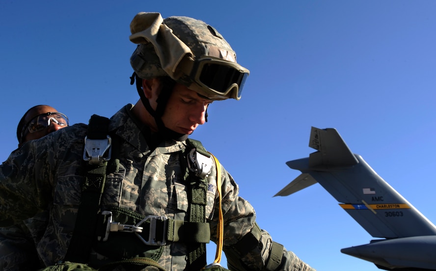 MOODY AIR FORCE BASE, Ga. -- Members of the 820th Security Forces Group prepare their equipment before boarding a C-17 Globemaster III for a jump during a joint exercise here Feb. 5. Operation Winged Eagle covered training events ranging from simulated munitions to airborne operations. (U.S. Air Force photo by Senior Airman Brittany Barker)
