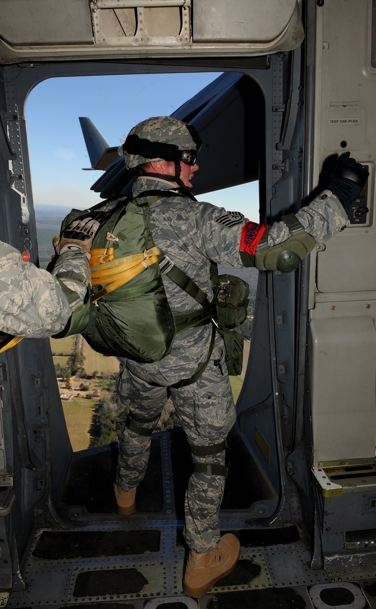 MOODY AIR FORCE BASE, Ga. -- An Airman with the 820th Security Forces Group prepares to perform a static line parachute jump out of a C-17 Globemaster III here Feb. 5. The 820th SFG did a joint jump with members from the II Squadron Royal Air Force Regiment from RAF Honington in Suffolk, Great Britain. (U.S. Air Force photo by Senior Airman Gina Chiaverotti)
