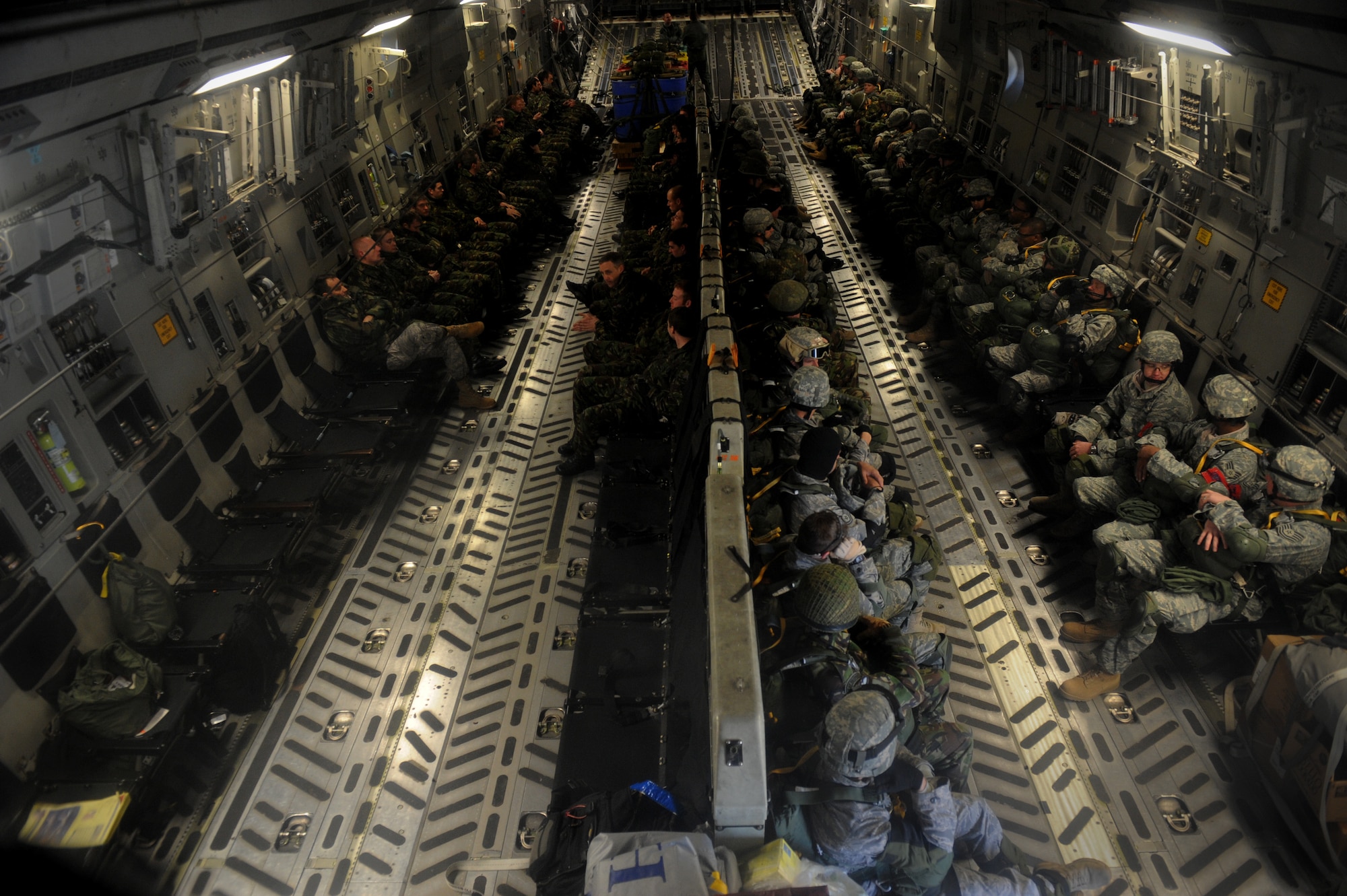 MOODY AIR FORCE BASE, Ga. -- Airmen from the 820th Security Forces Group and members from the II Squadron Royal Air Force Regiment from RAF Honington in Suffolk, Great Britain wait before performing a static line parachute jump here Feb. 5. The Airmen were jumping out of a C-17 Globemaster III aircraft. (U.S. Air Force photo by Senior Airman Gina Chiaverotti)
