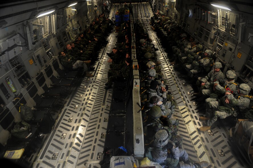 MOODY AIR FORCE BASE, Ga. -- Airmen from the 820th Security Forces Group and members from the II Squadron Royal Air Force Regiment from RAF Honington in Suffolk, Great Britain wait before performing a static line parachute jump here Feb. 5. The Airmen were jumping out of a C-17 Globemaster III aircraft. (U.S. Air Force photo by Senior Airman Gina Chiaverotti)
