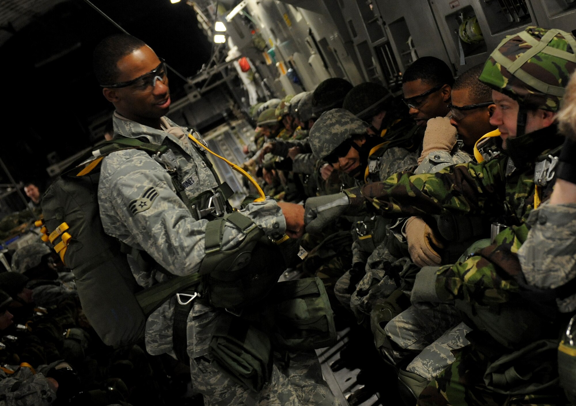 MOODY AIR FORCE BASE, Ga. -- Senior Airman Devant Davis-Jones, 820th Security Forces Group, motivates jumpers before a static line parachute jump out of a C-17 Globemaster III here Feb. 5. The 820th SFG was performing a joint jump with members of the II Squadron Royal Air Force Regiment from RAF Honington in Suffolk, Great Britain. (U.S. Air Force photo by Senior Airman Gina Chiaverotti)
