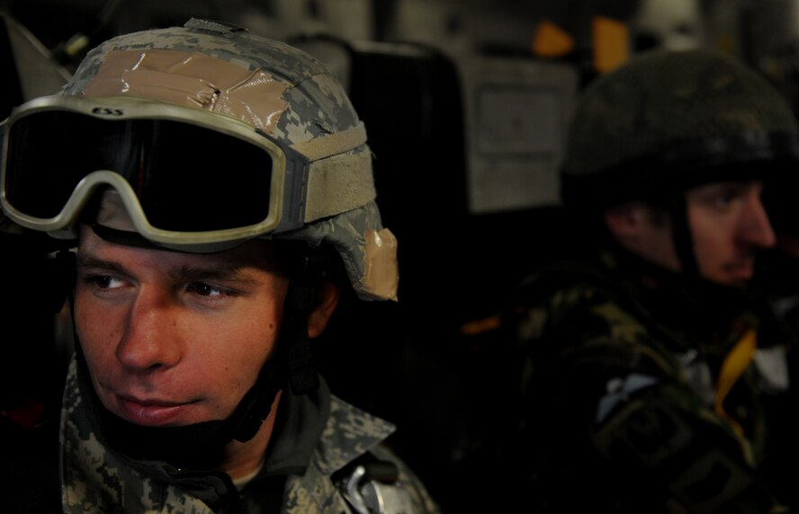 MOODY AIR FORCE BASE, Ga. -- An Airman from the 820th Security Forces Group watches while a member of the II Squadron Royal Air Force regiment waits to perform a static line parachute jump here Feb. 5. The II Squadron, RAF Regiment from RAF Honington in Suffolk, Great Britain. (U.S Air Force photo by Senior Airman Gina Chiaverotti)
