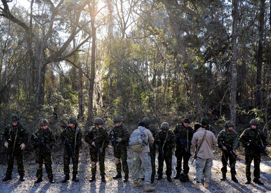 MOODY AIR FORCE BASE, Ga. -- Members of the II Squadron Royal Air Force Regiment from RAF Honington in Suffolk, Great Britain, are given instructions by members of the 820th Security Forces Group before participating in a training exercise here Feb. 4. The RAF is participating in events ranging from simulated munitions training to airborne operations during Operation Winged Eagle. (U.S. Air Force photo by Senior Airman Brittany Barker)
