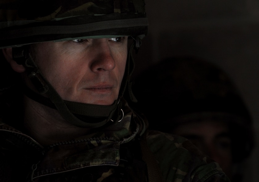 MOODY AIR FORCE BASE, Ga. -- A member of the II Squadron  Royal Air Force Regiment from RAF Honington in Suffolk, Great Britain, listens as an Airman from the 820th Security Forces Group instruct them on clearing a house in a military operations in urban terrain village here Feb. 4.  (U.S. Air Force photo by Senior Airman Gina Chiaverotti)